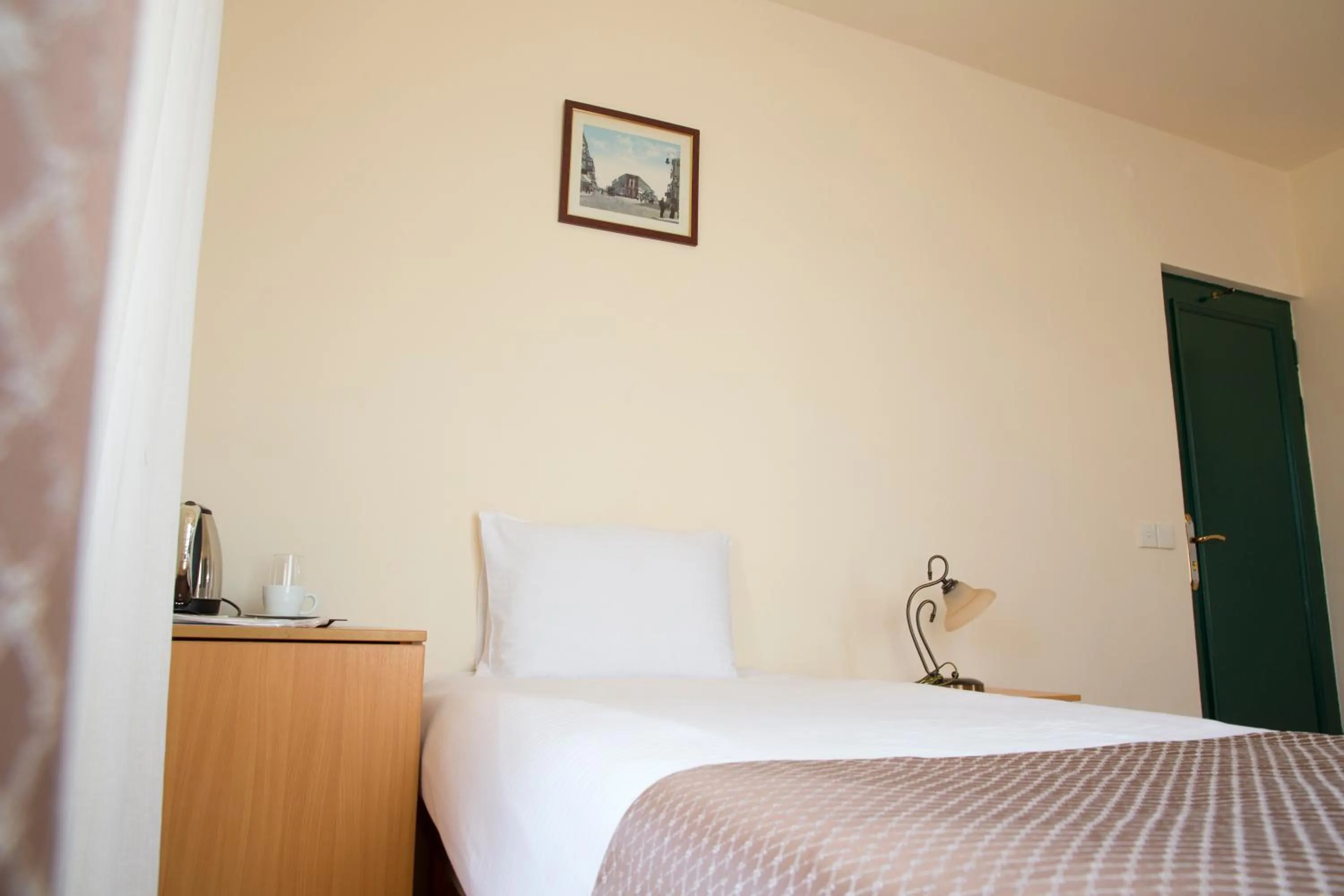 Bed in Old City Inn Hotel