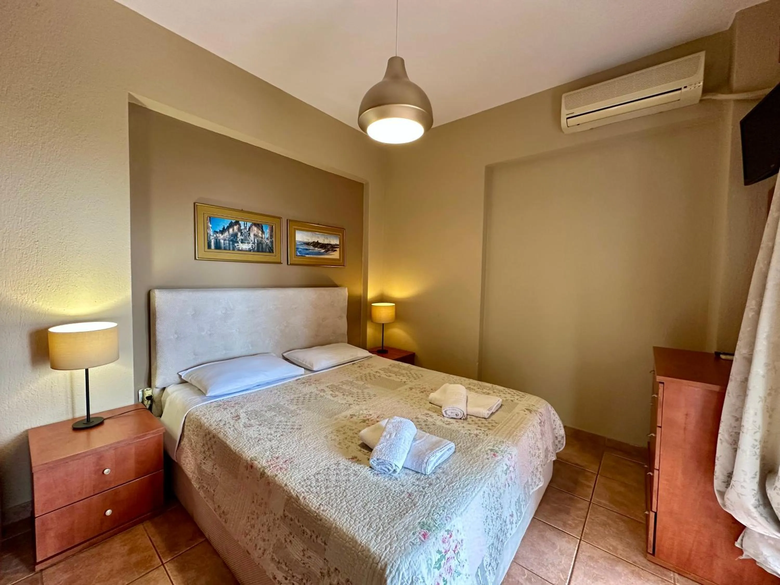 Bed in Agrili Apartments & Rooms
