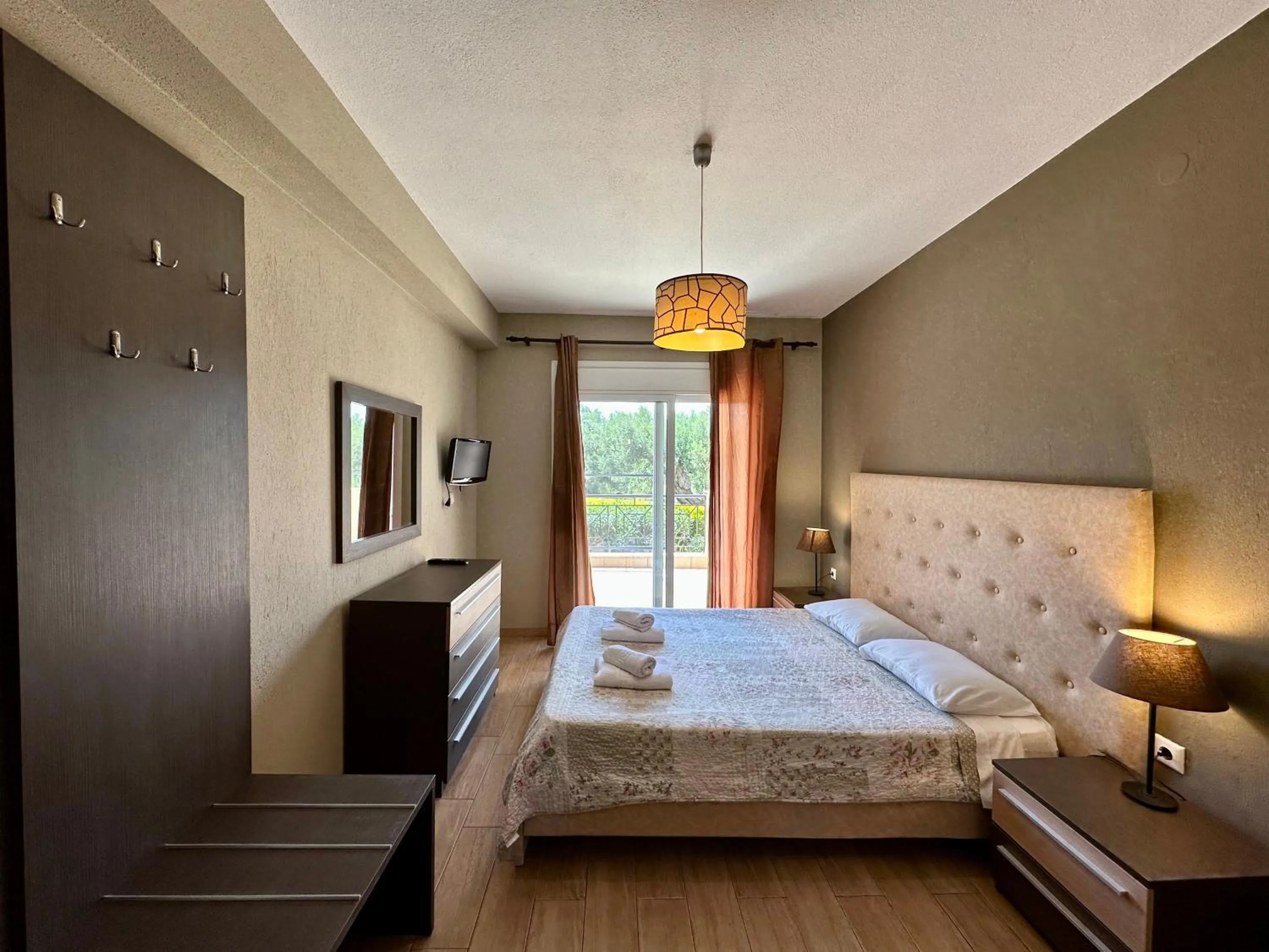 Bed in Agrili Apartments & Rooms