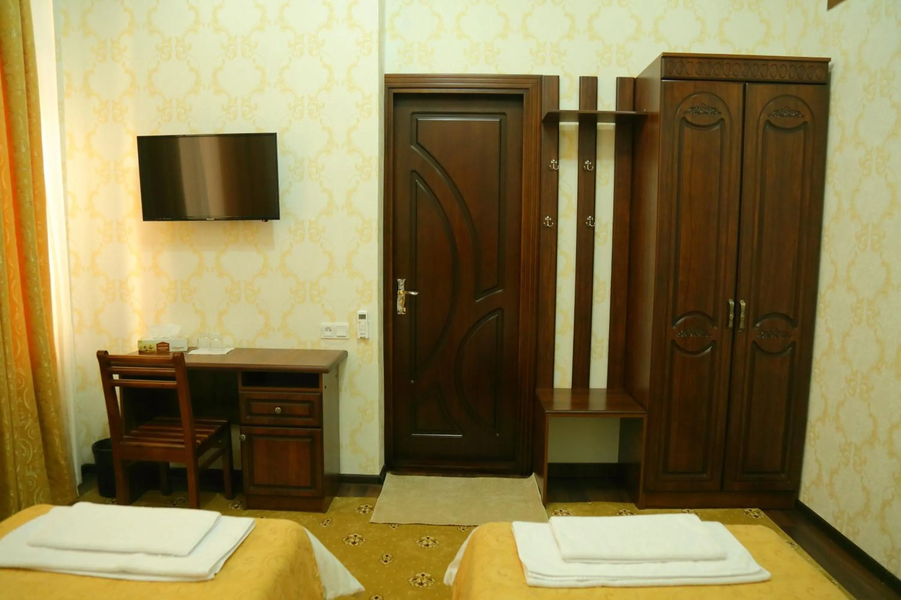 Bed in Muzaffar Hotel Samarkand