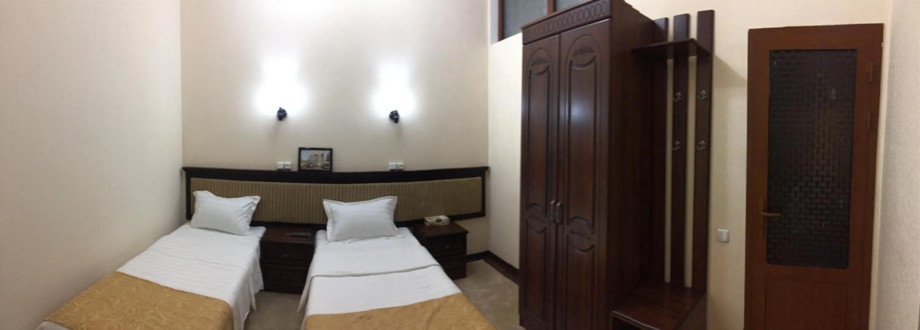 Bed in Muzaffar Hotel Samarkand