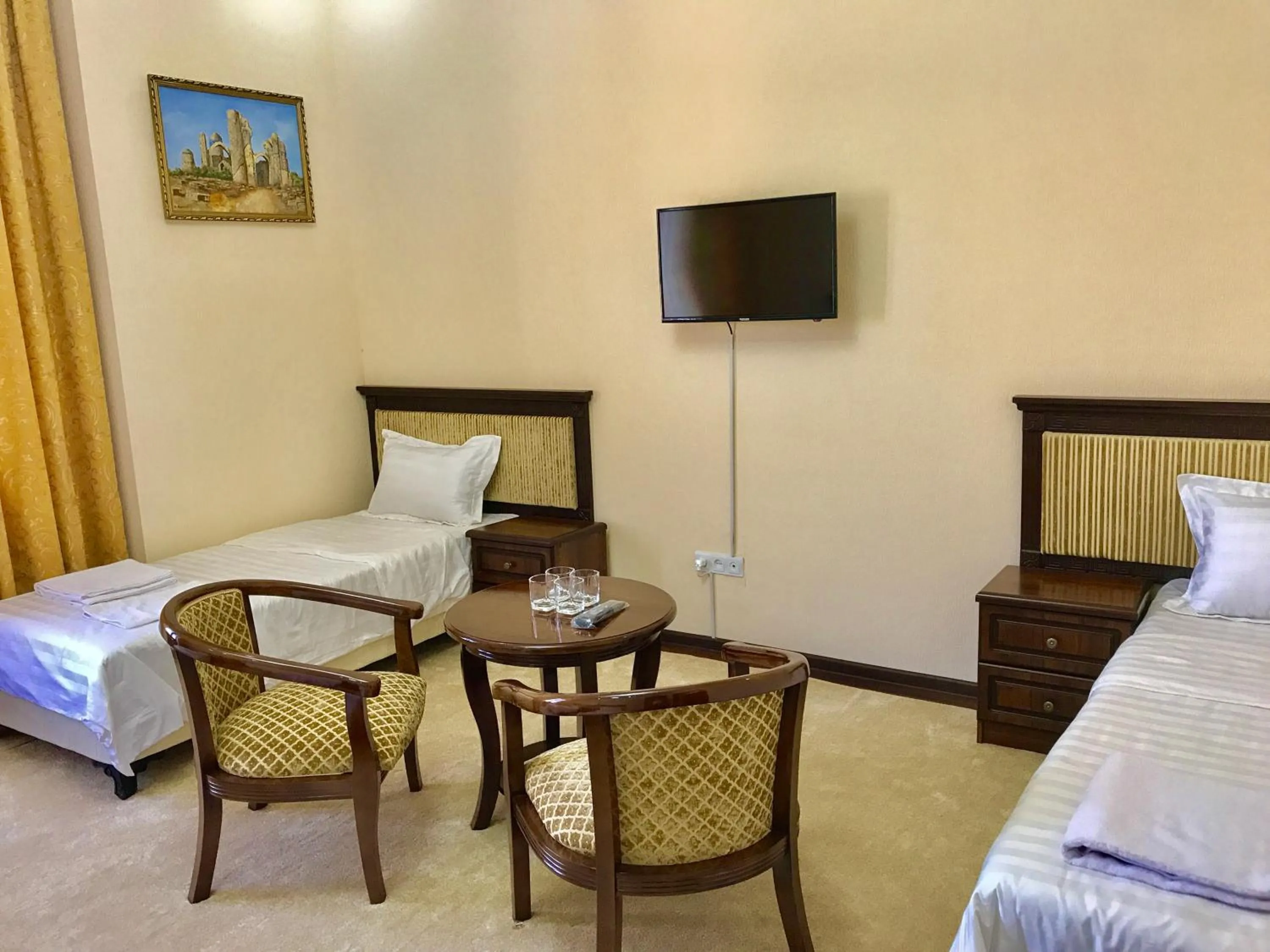 Bed in Muzaffar Hotel Samarkand