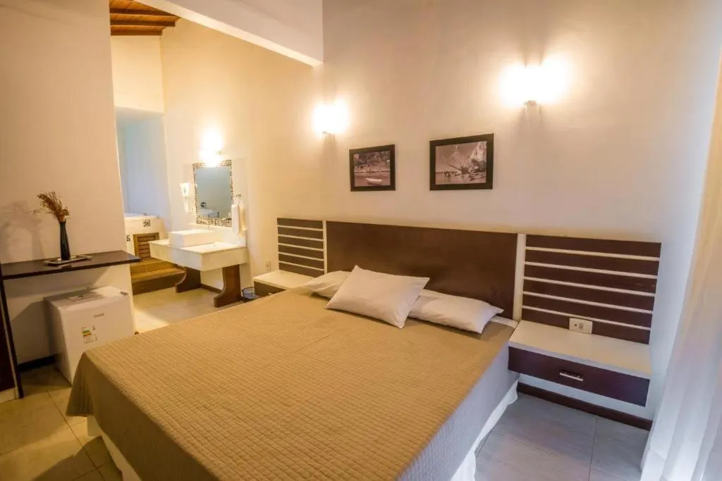 Bed in Pousada Ilha da Saudade