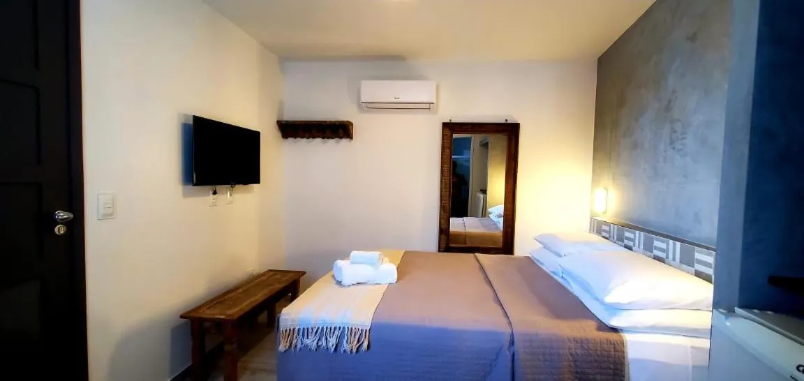 Bed in Pousada Ilha da Saudade