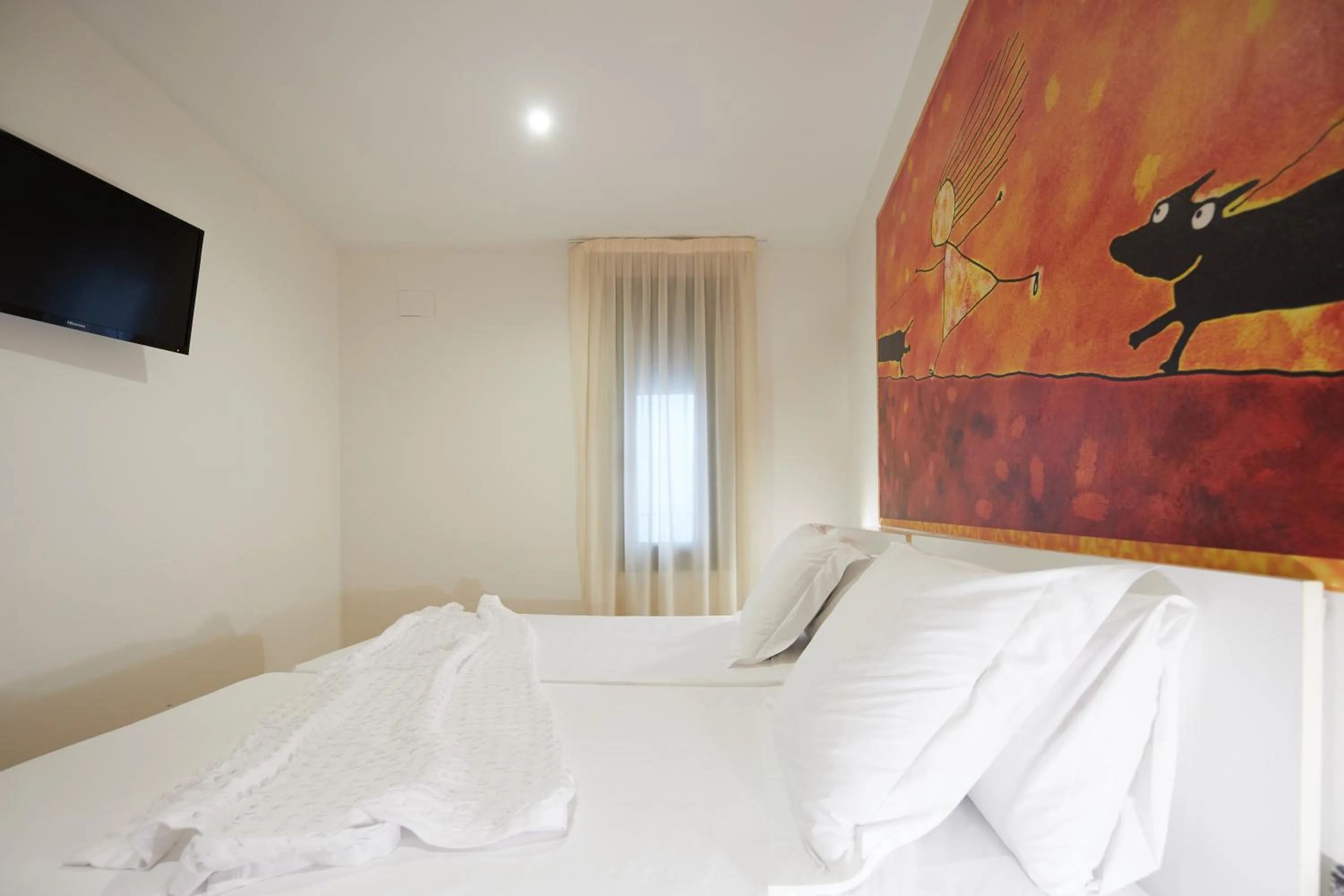 Bed in Apart-Suites Hostemplo