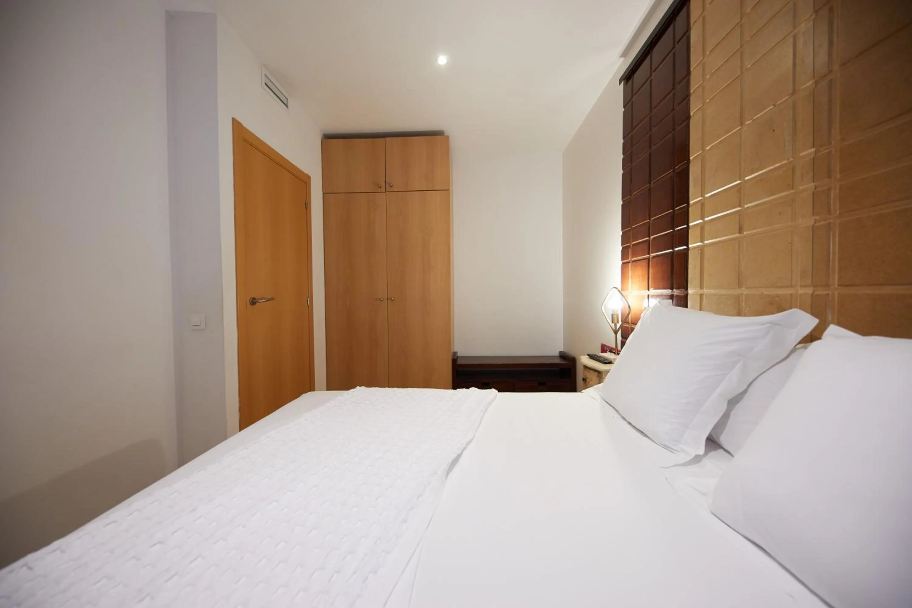 Bed in Apart-Suites Hostemplo