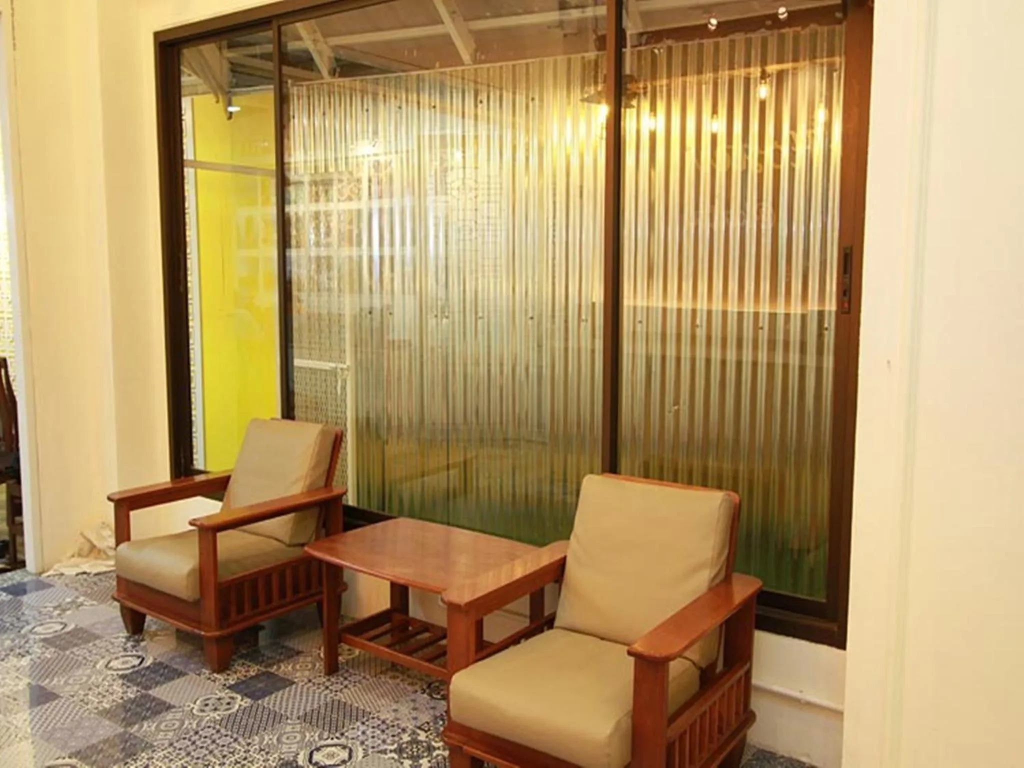 Communal lounge/ TV room in Sino Hostel @ Kata