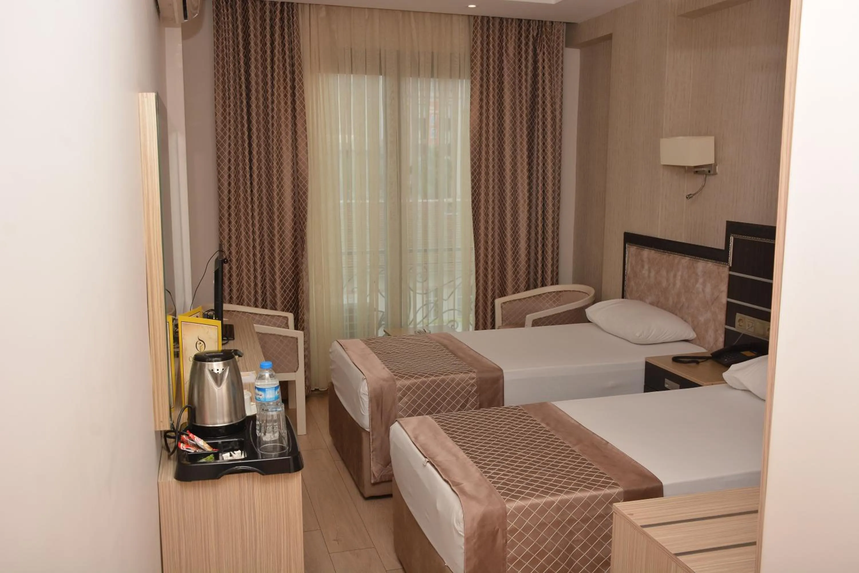 Bed in Othello Hotel