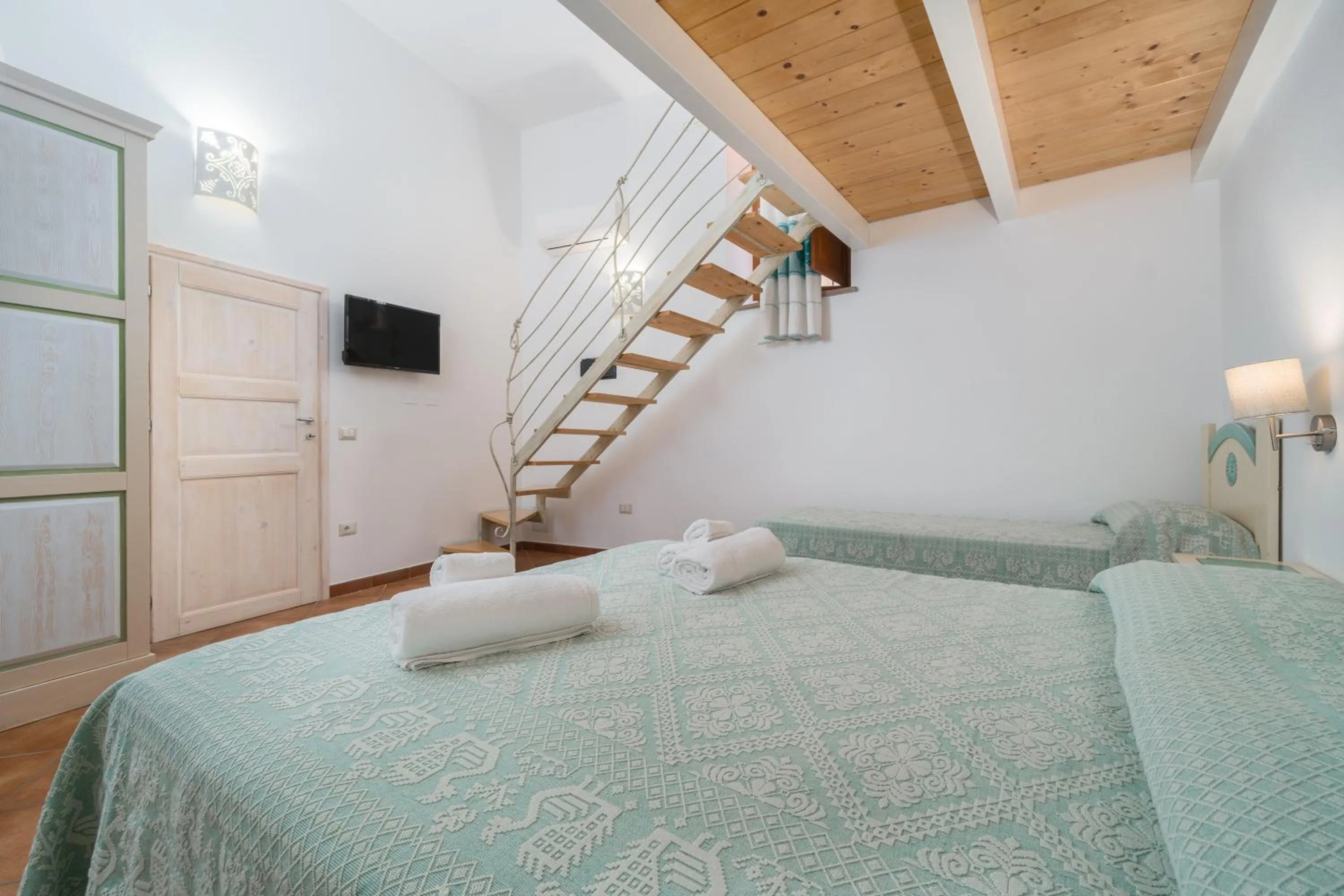 Bed in Bosa Queen House