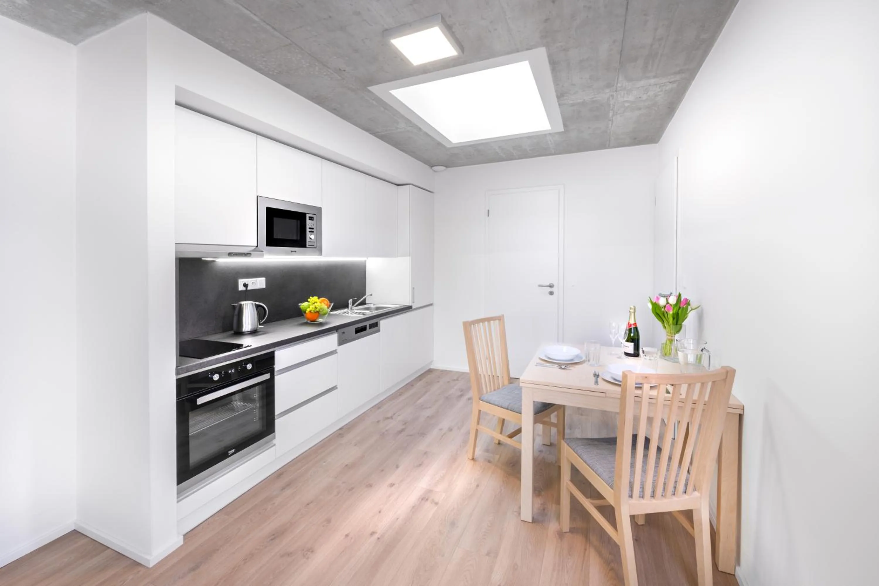 Kitchen or kitchenette in DownTown Suites Belohorska