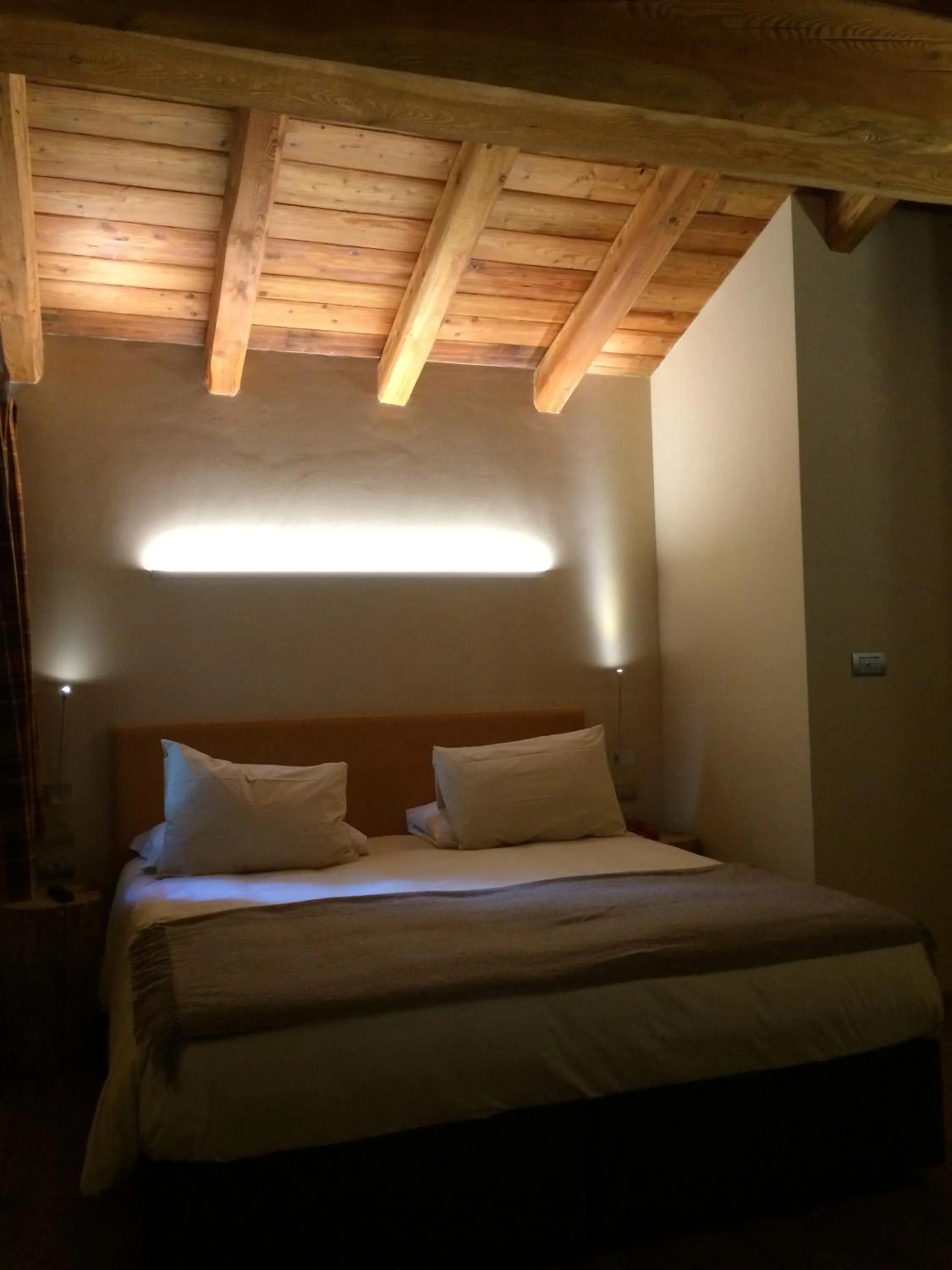 Bed in Chalet Eden Eco Hotel, Restaurant & Wellness