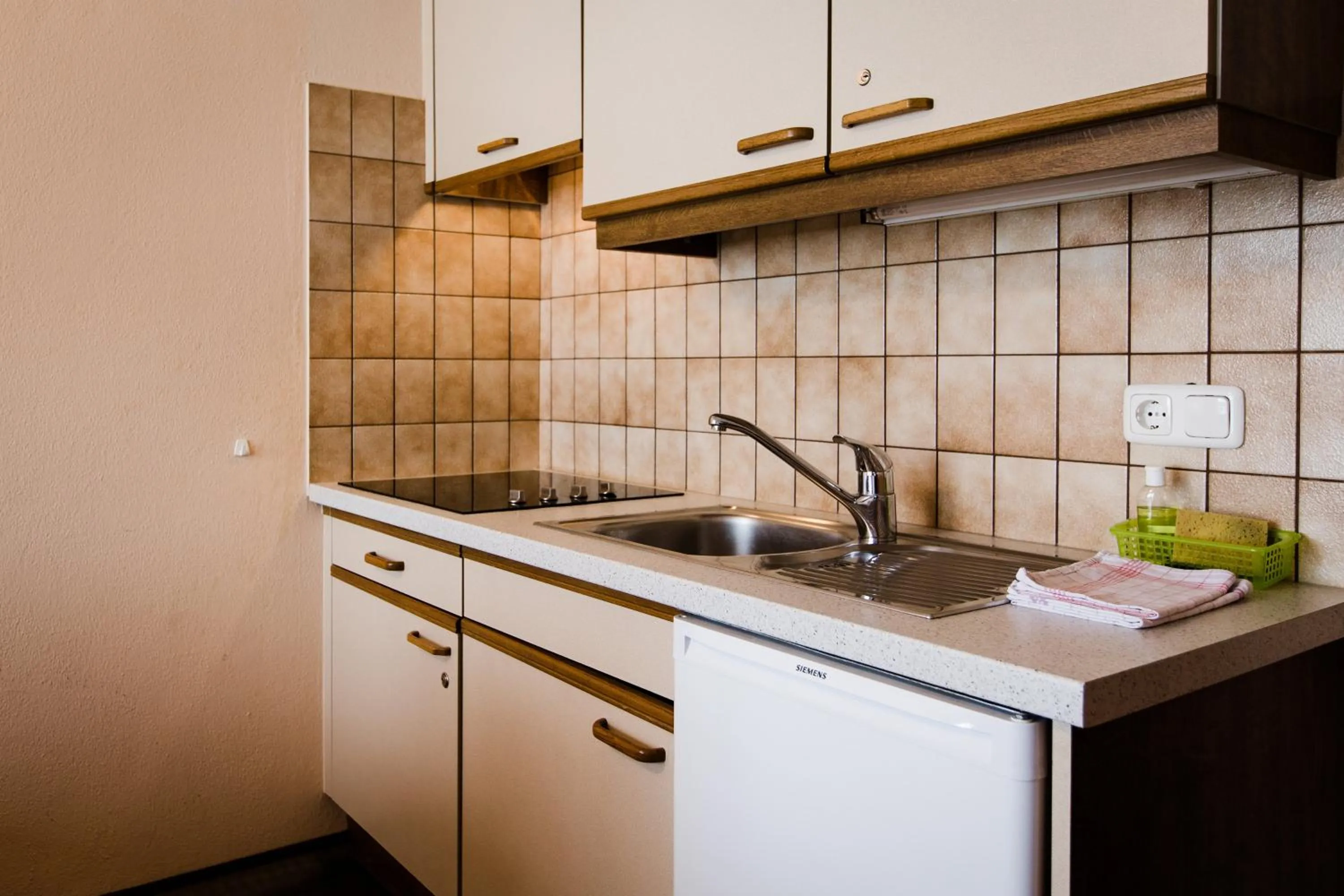 Kitchen or kitchenette in Aparthotel Dorfplatzl Garni Apartments & B&B