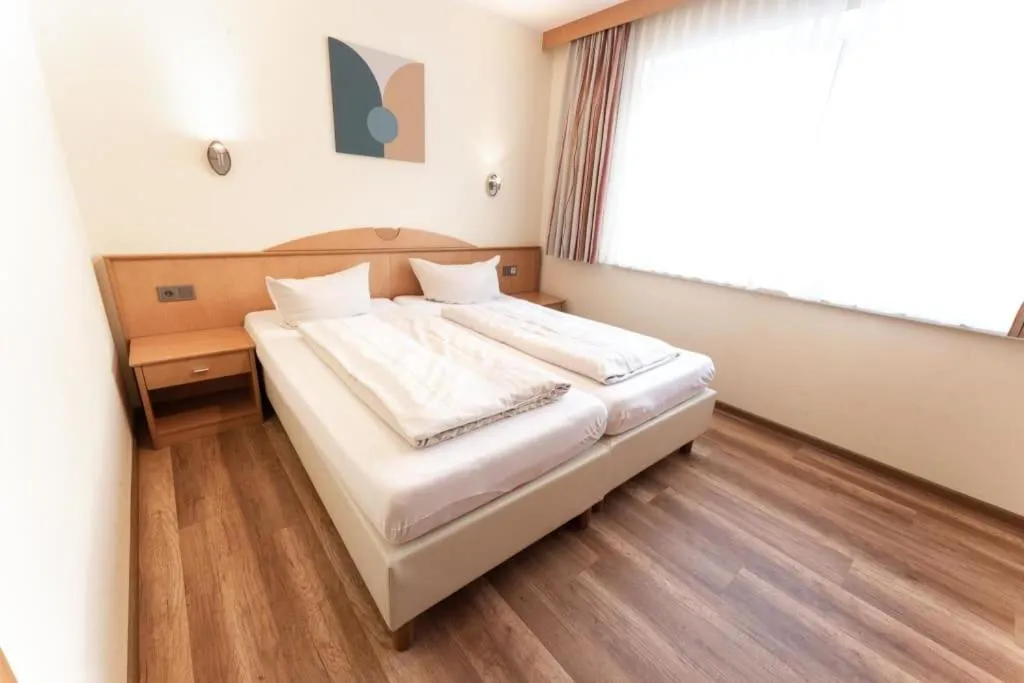 Bedroom, Bed in Aparthotel Dorfplatzl Garni Apartments & B&B