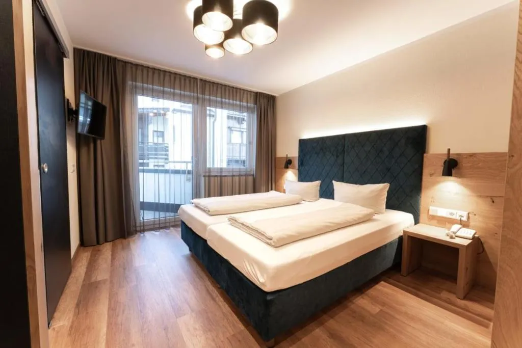Bedroom, Bed in Aparthotel Dorfplatzl Garni Apartments & B&B