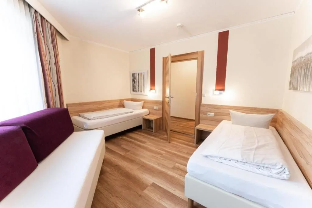 Bedroom, Bed in Aparthotel Dorfplatzl Garni Apartments & B&B