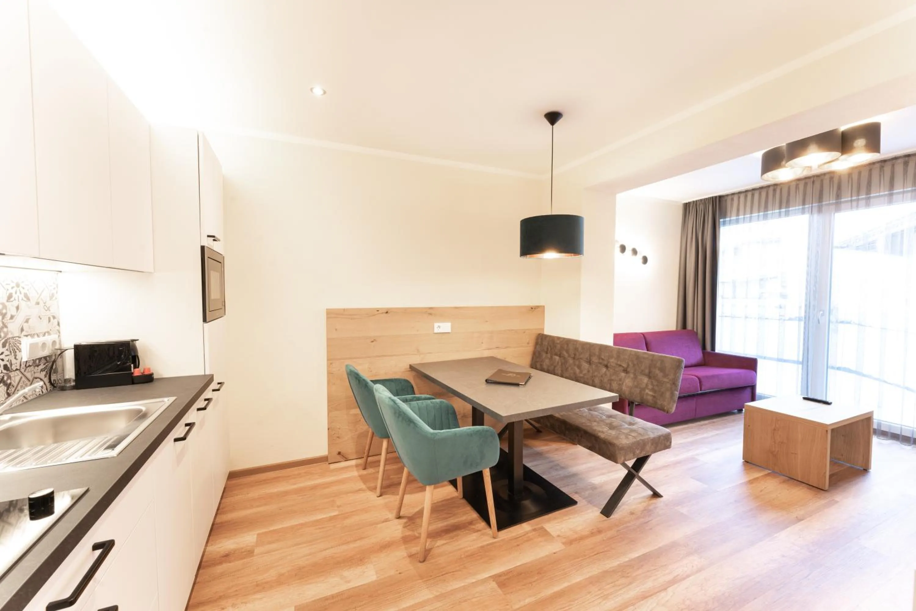 Kitchen or kitchenette in Aparthotel Dorfplatzl Garni Apartments & B&B