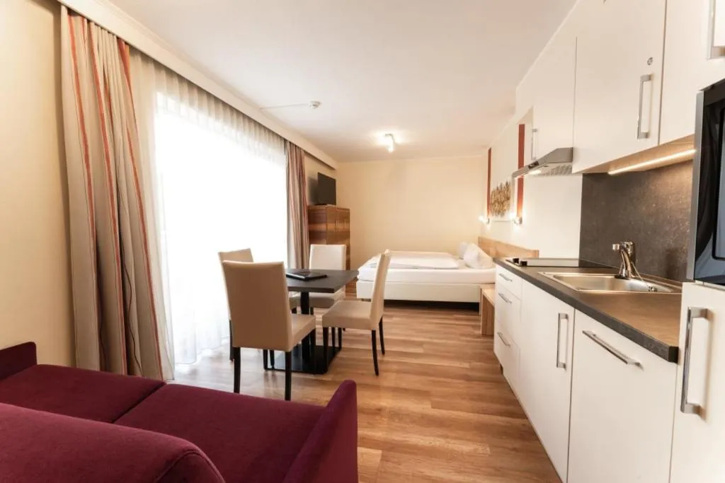 Seating area, Bed in Aparthotel Dorfplatzl Garni Apartments & B&B