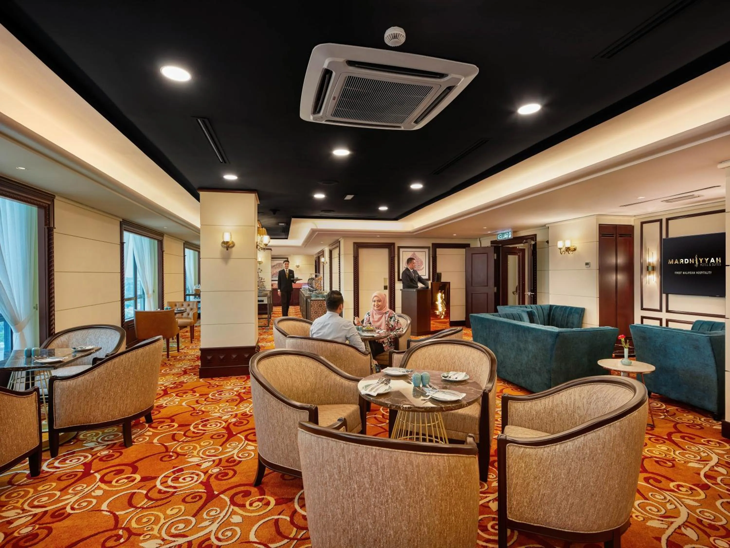 Communal lounge/ TV room in Mardhiyyah Hotel and Suites
