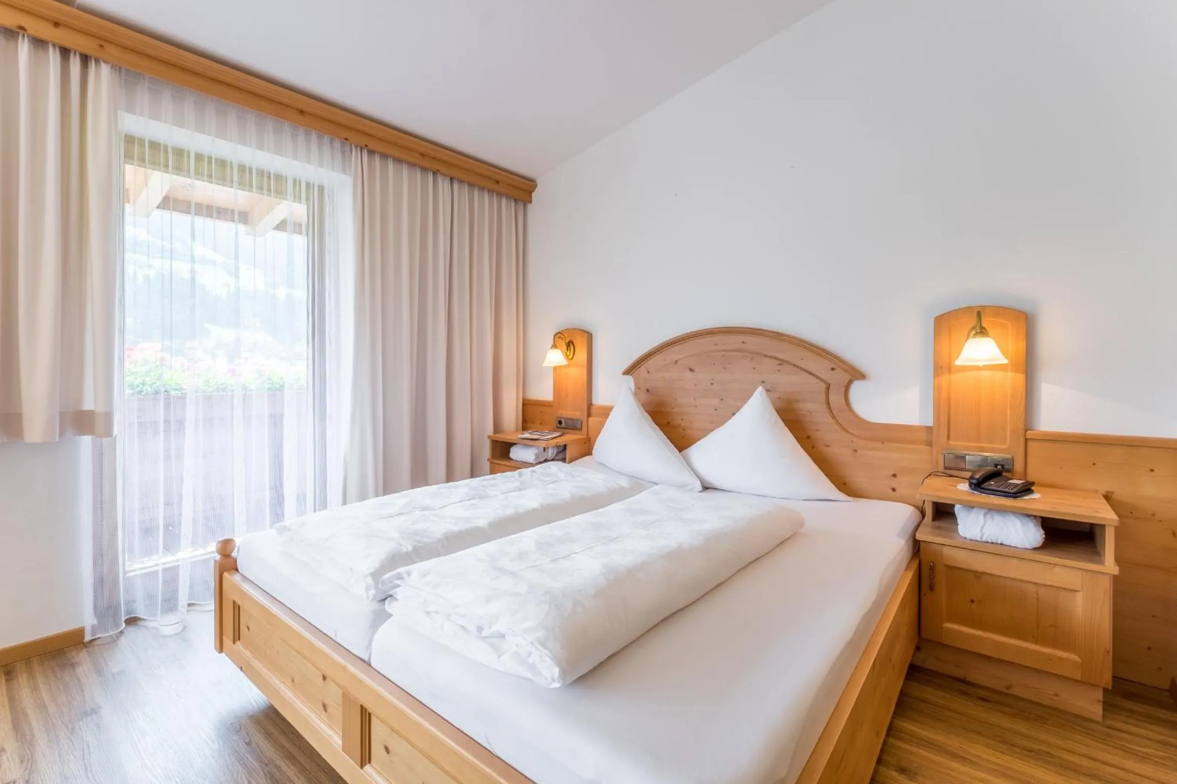 Bedroom, Bed in Hotel Riedl im Zillertal