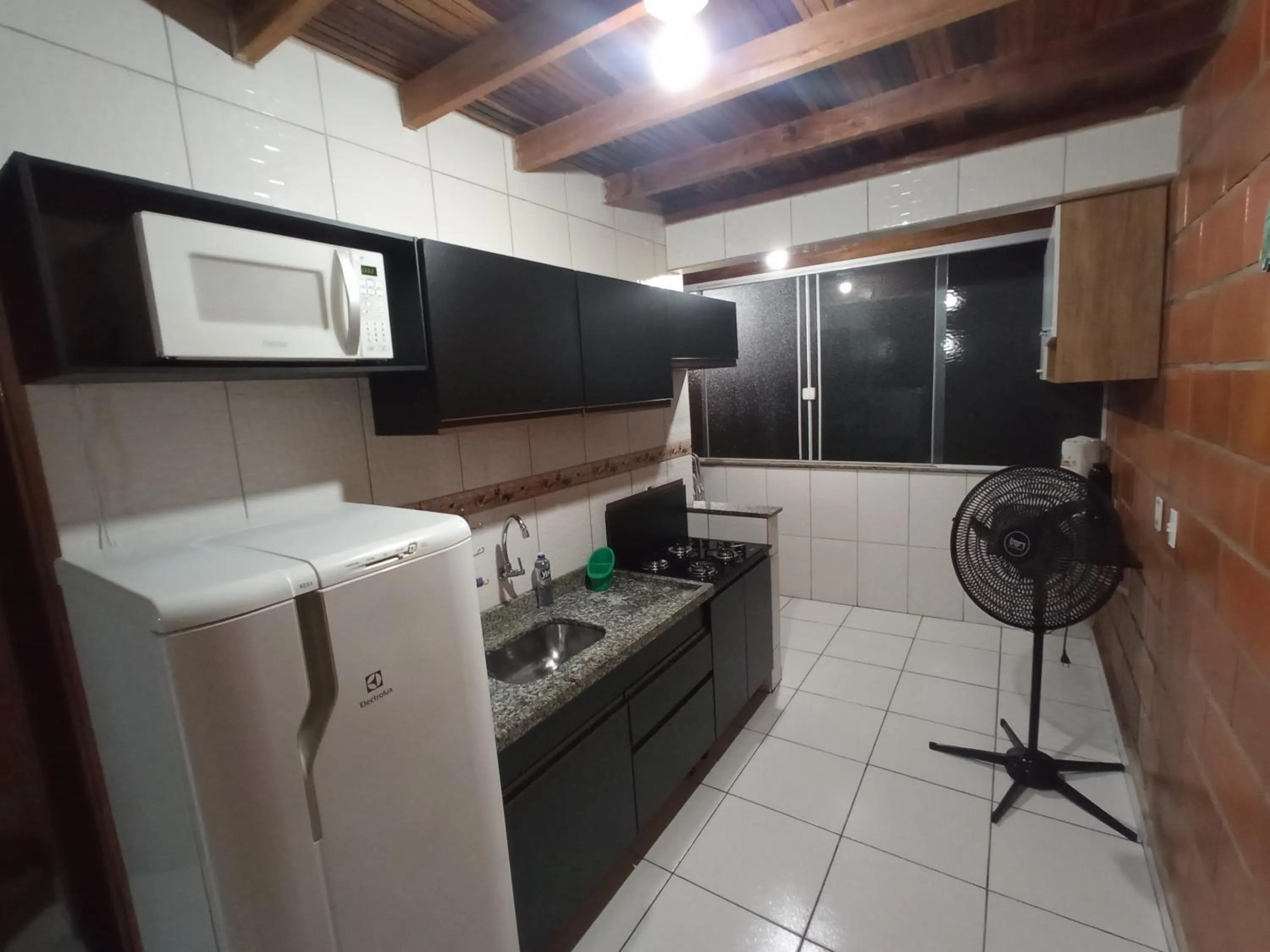 Kitchen or kitchenette in Maranduba Ville II