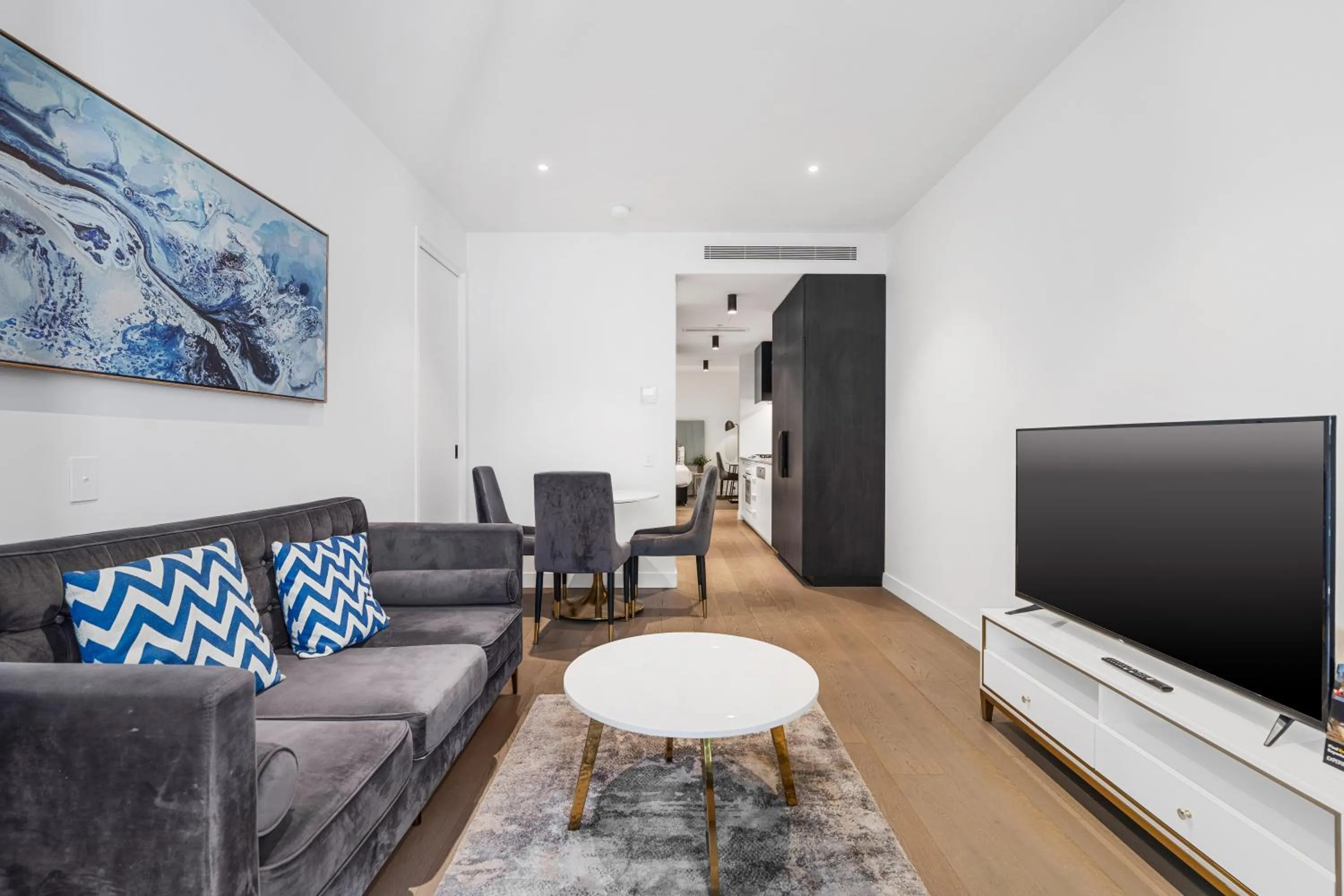 Living room in The Eminence Apartments by CLLIX