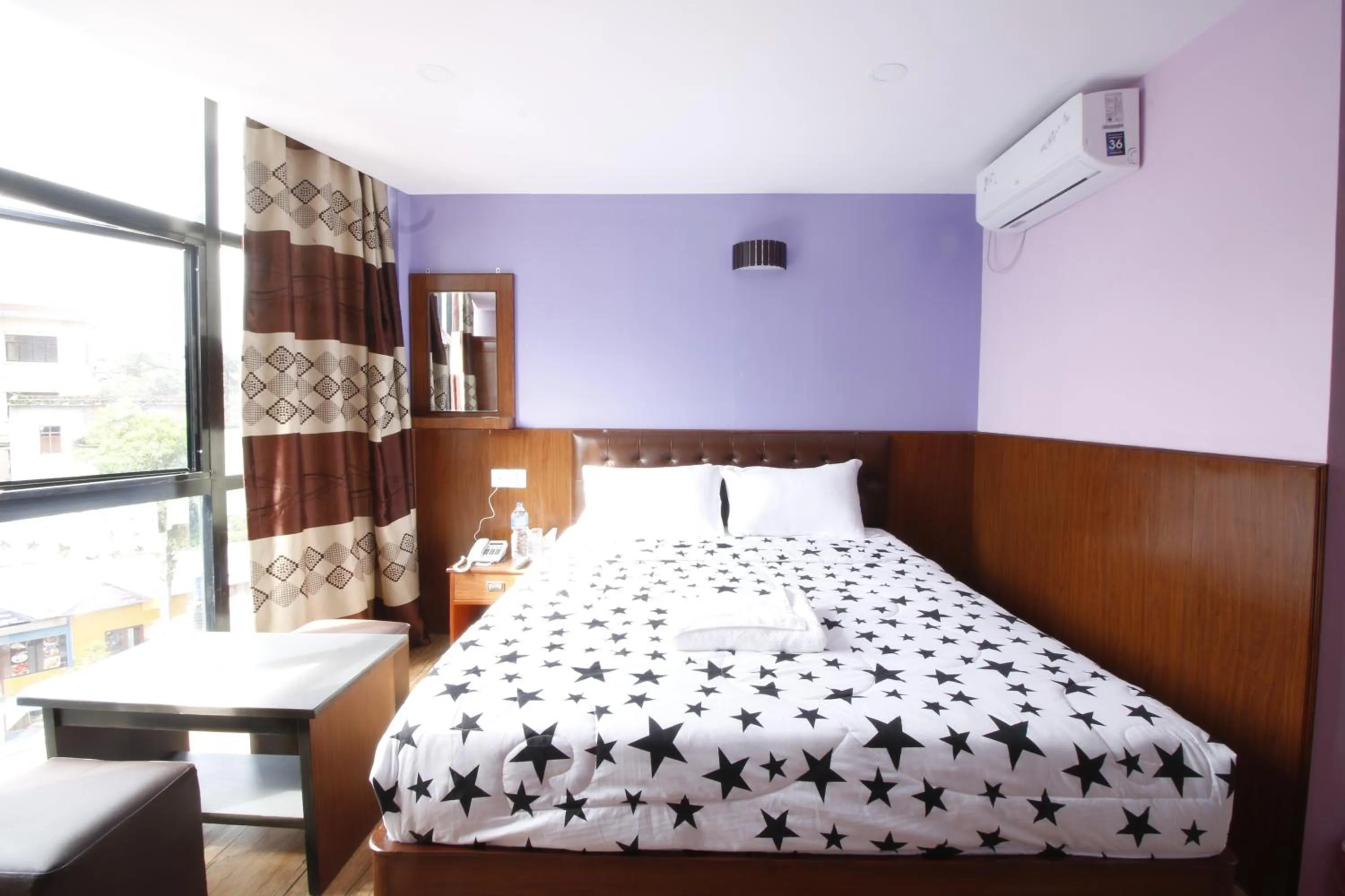 Bed in Everest Holiday Inn