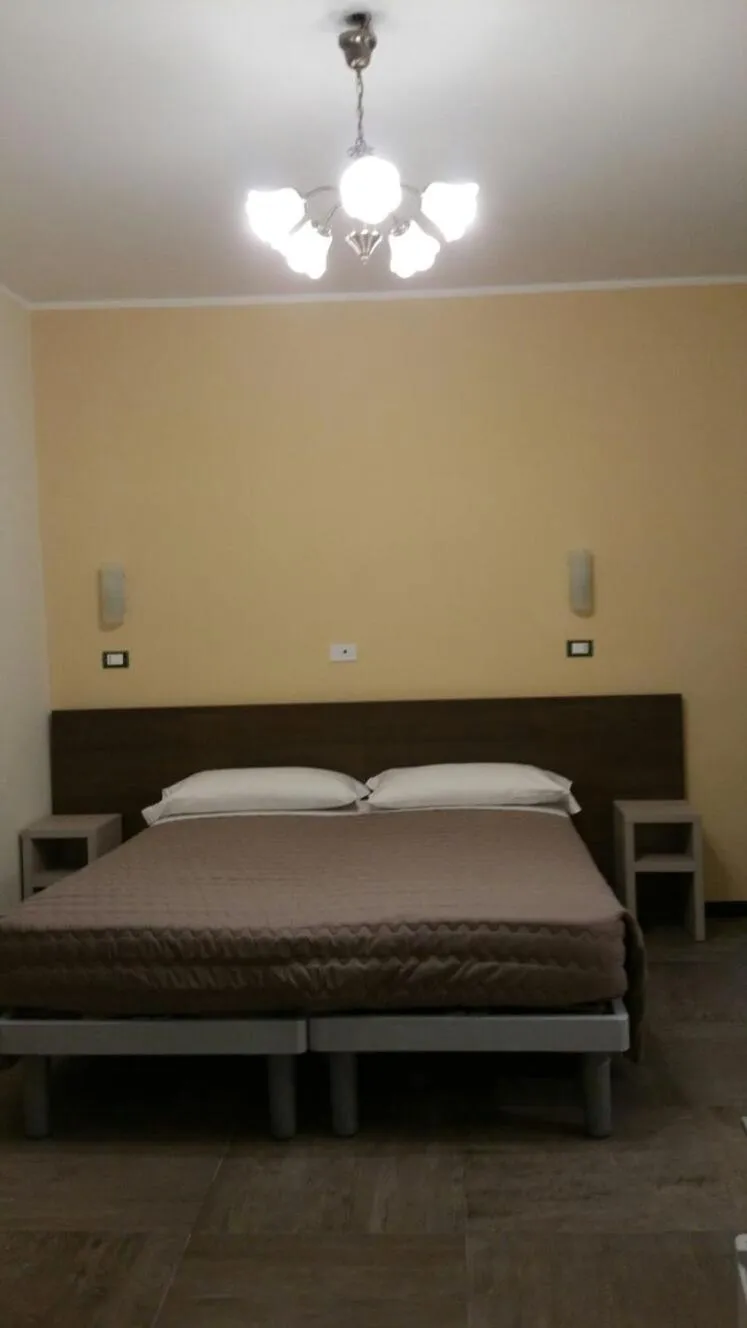 Bed in Hotel Tommaseo