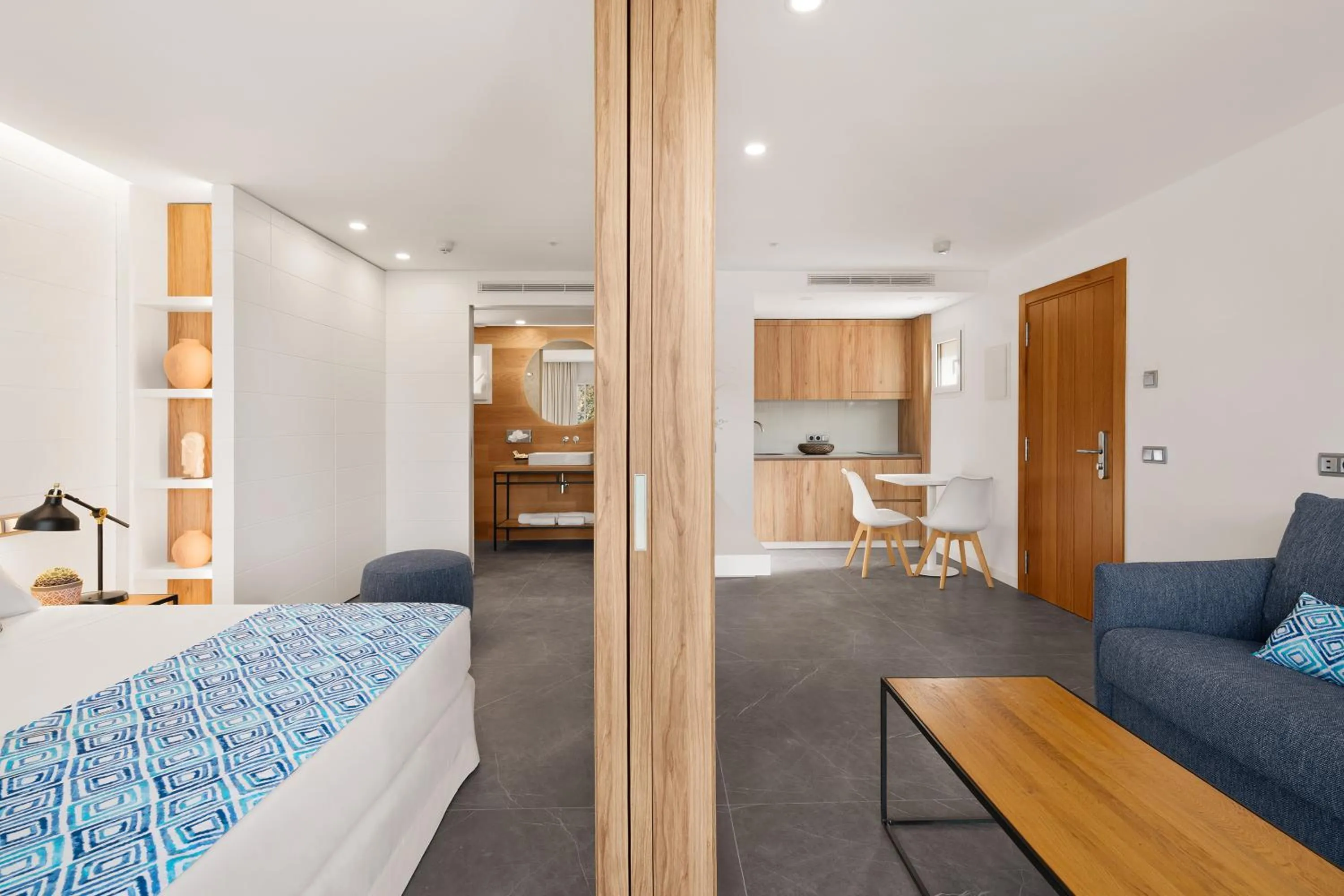 Living room, Bed in Bahia Suites Camp de Mar