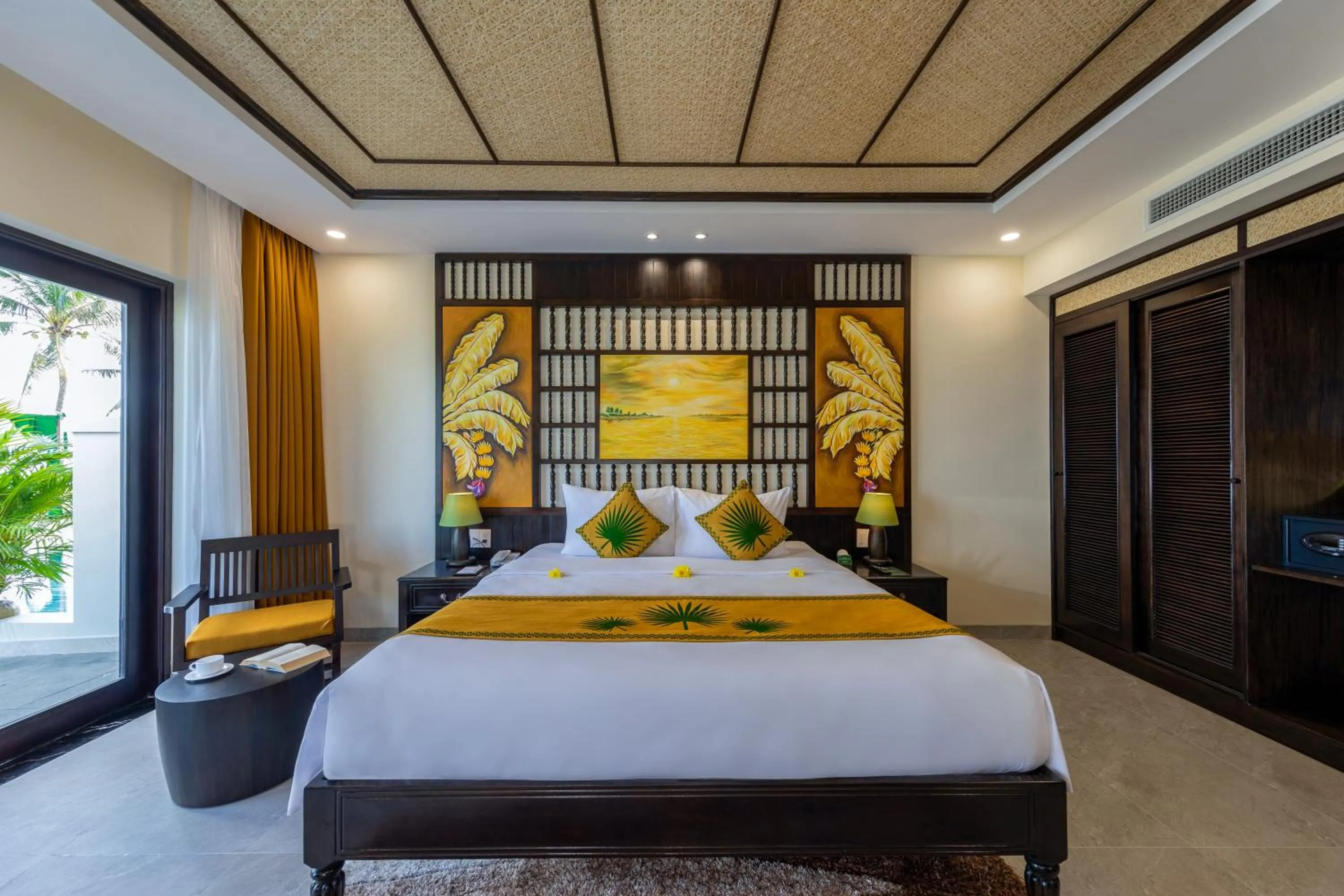 Bed in Palm Garden Beach Resort & Spa