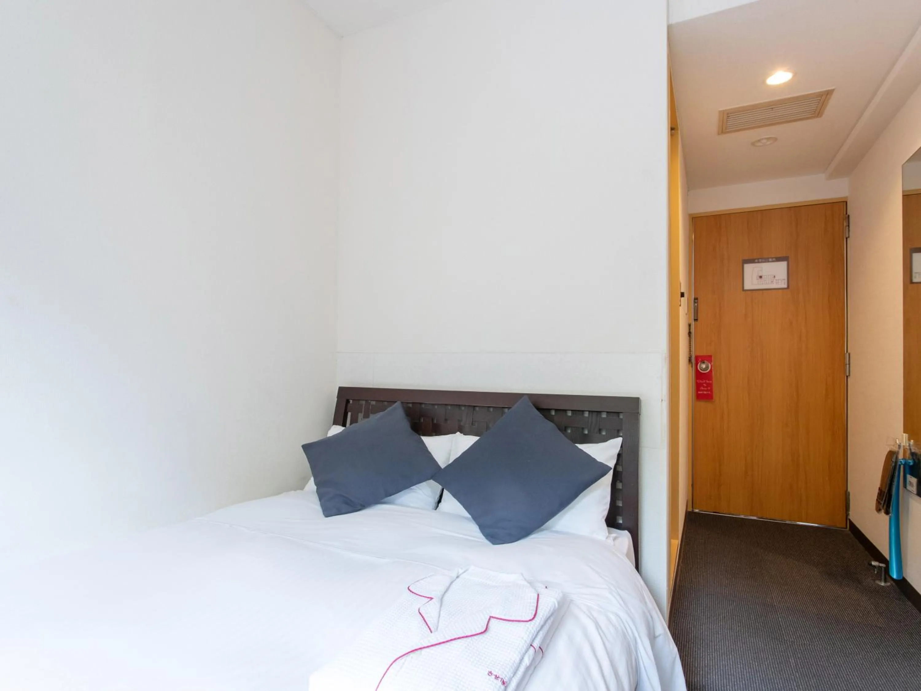 Bed in Tabist Sasebo Palace Hotel