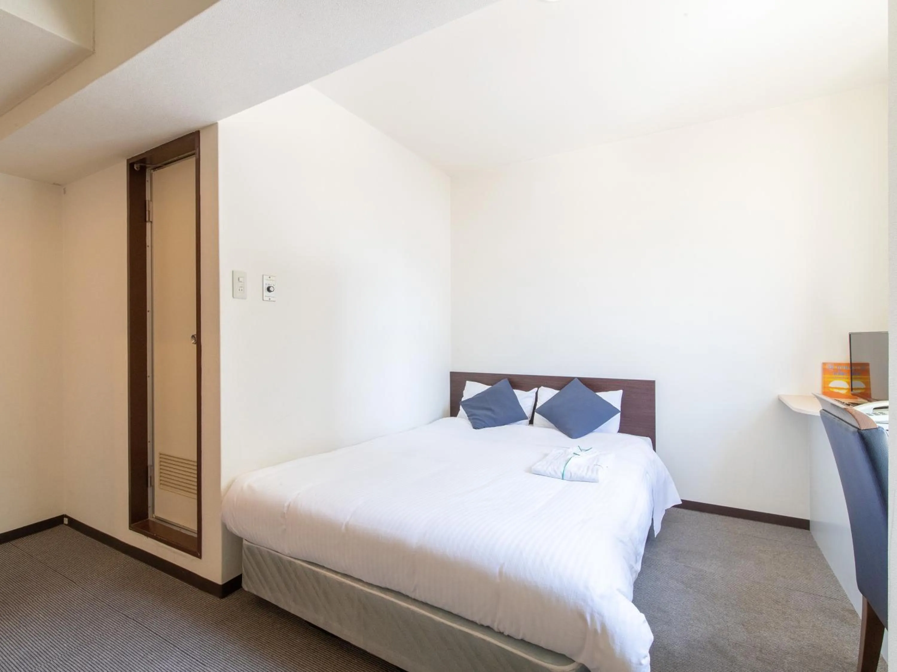 Bed in Tabist Sasebo Palace Hotel