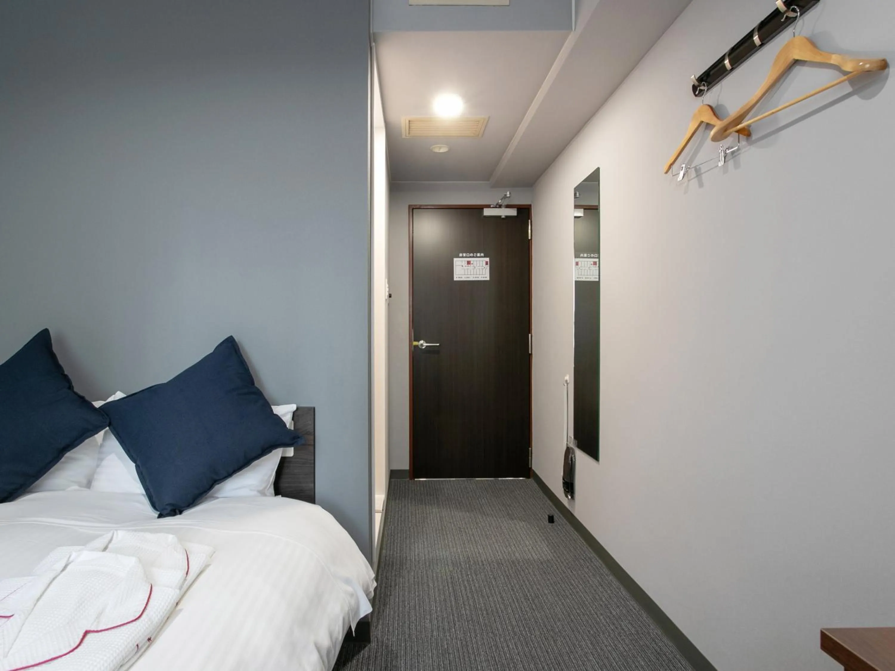 Bed in Tabist Sasebo Palace Hotel