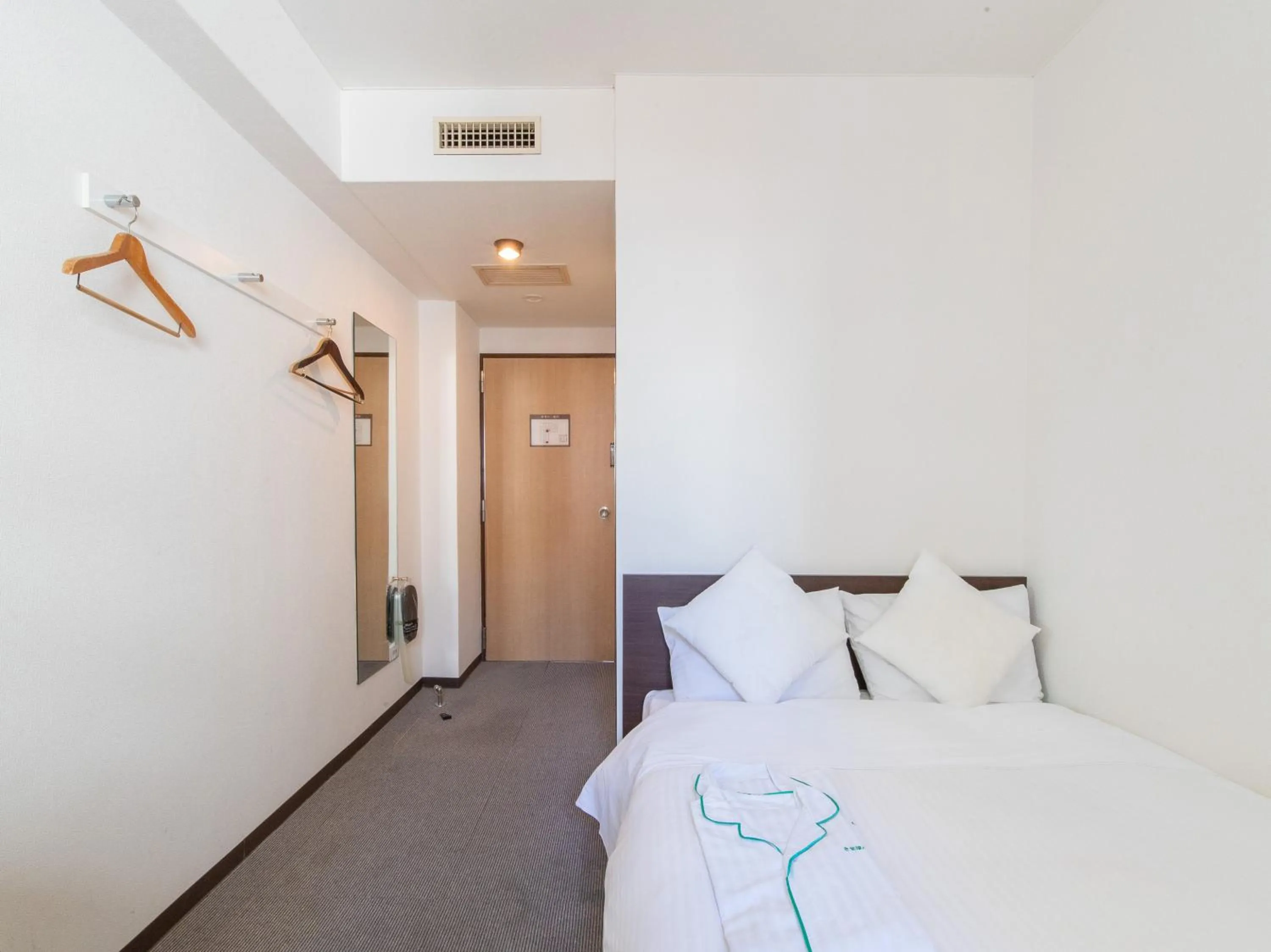 Bed in Tabist Sasebo Palace Hotel