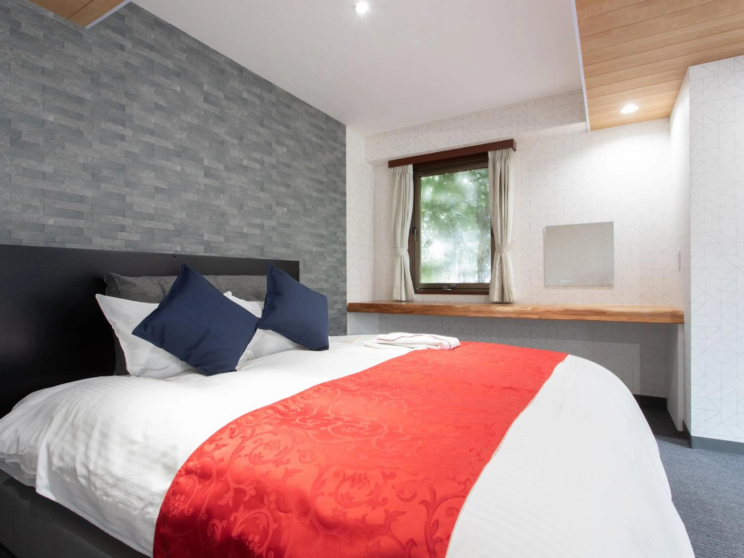 Bed in Tabist Sasebo Palace Hotel