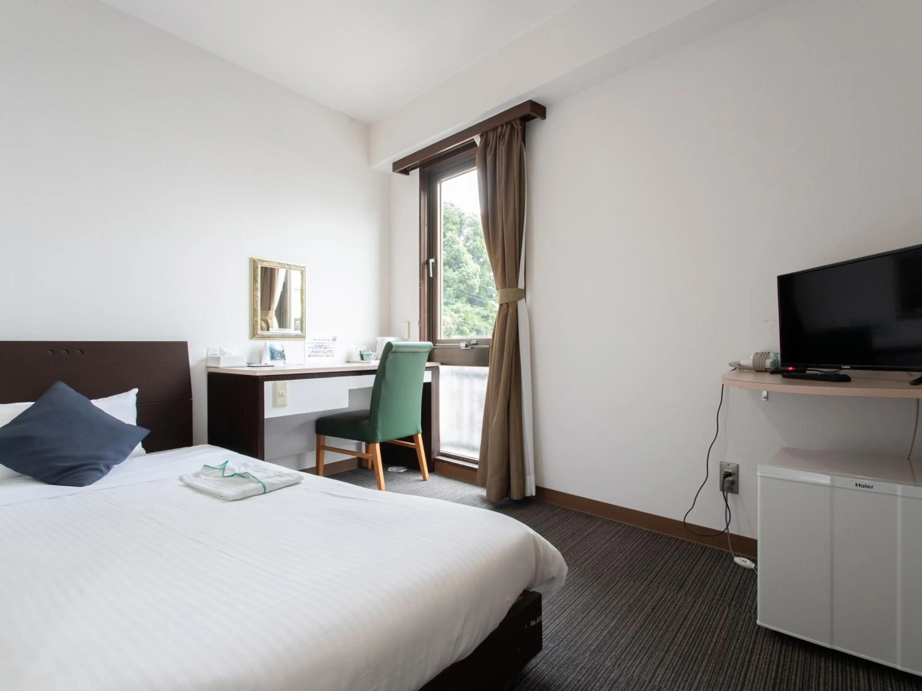 Bed in Tabist Sasebo Palace Hotel