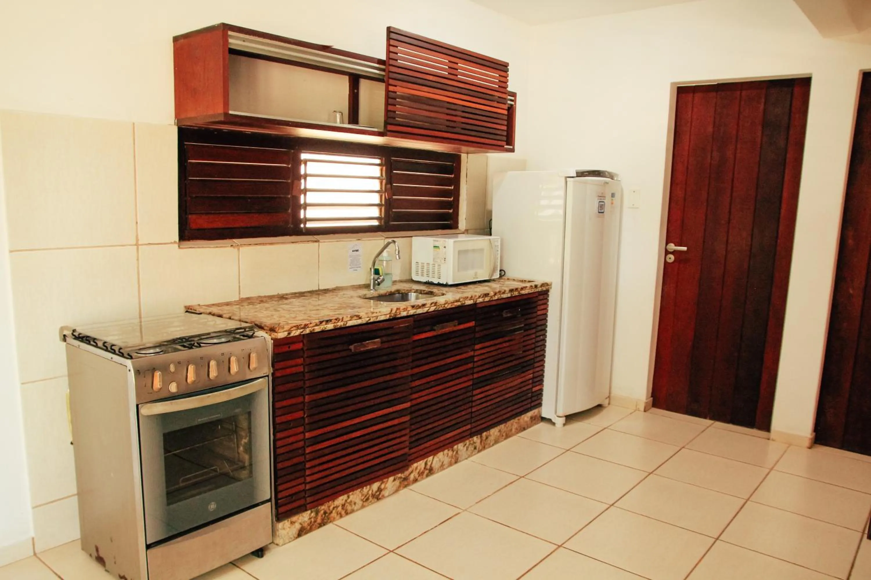 Kitchen or kitchenette in Pipa Panorama Aparthotel