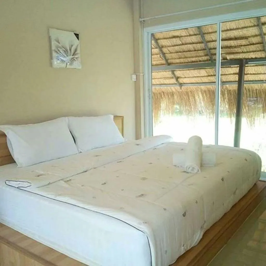 Bed in Suwi Coco Ville Resort