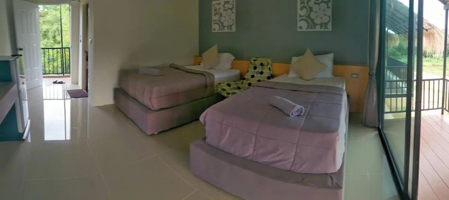 Bed in Suwi Coco Ville Resort