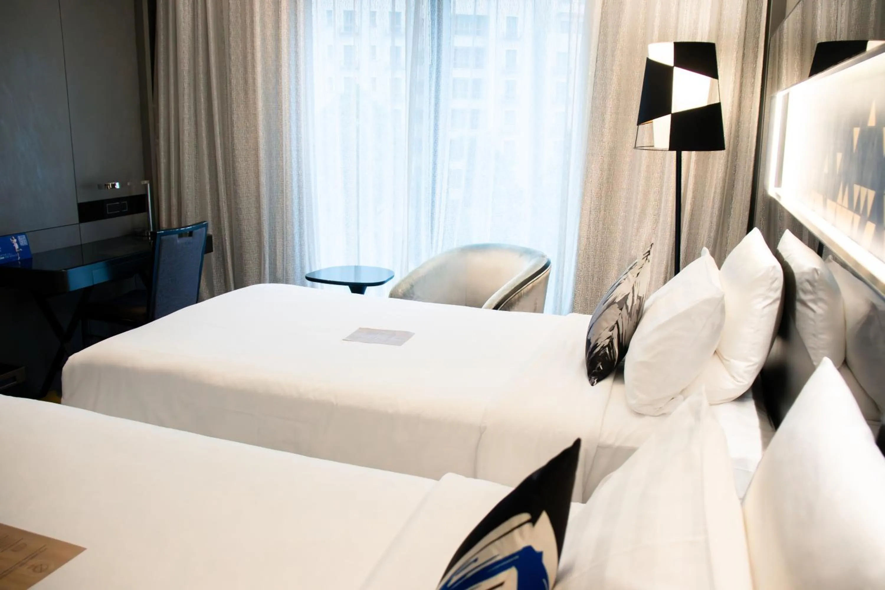 Bed in Novotel Singapore On Stevens