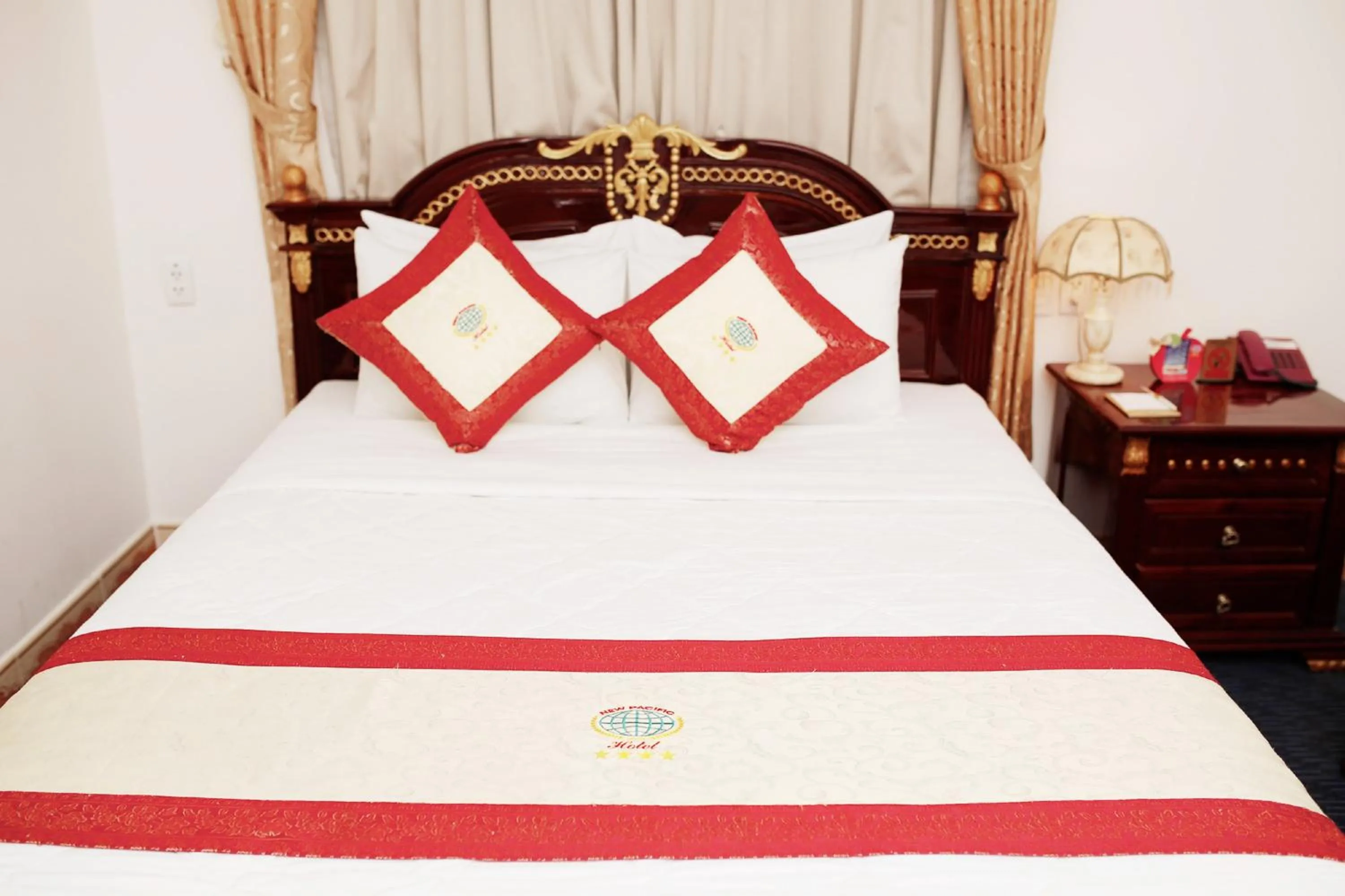 Bed in New Pacific Hotel