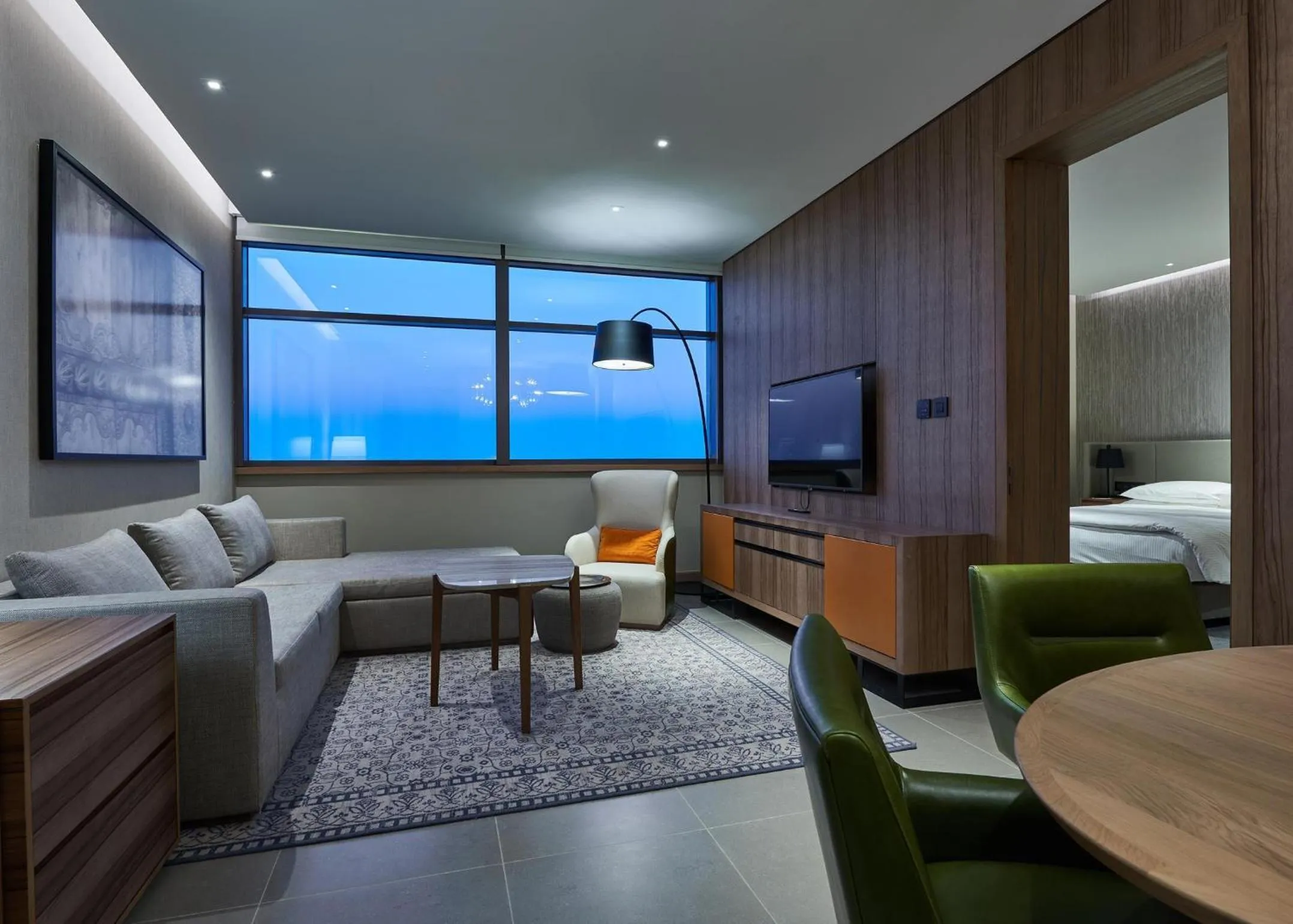 Living room, Bed in Mysk Al Mouj Hotel