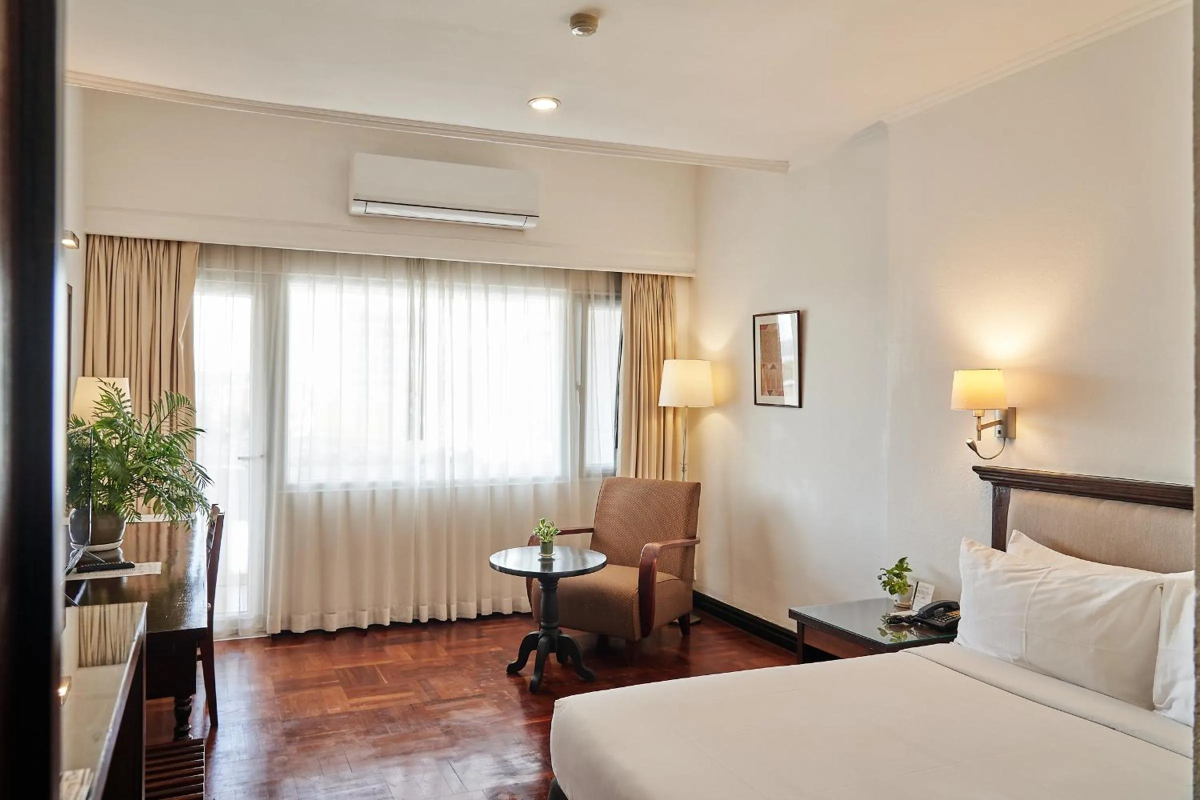 Bed in Le Charme Vientiane Hotel