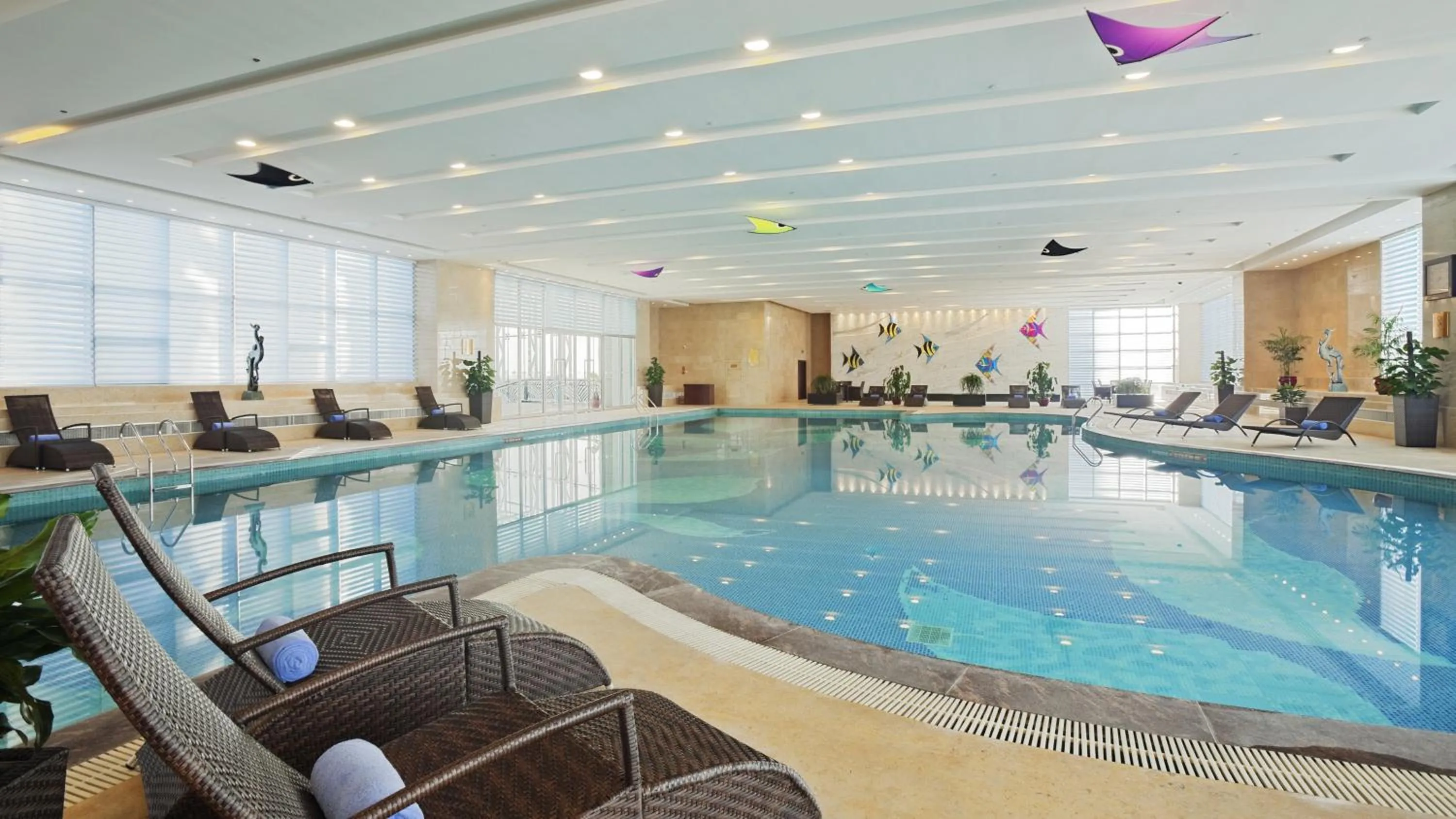 Swimming pool in Crowne Plaza Yantai Sea View by IHG