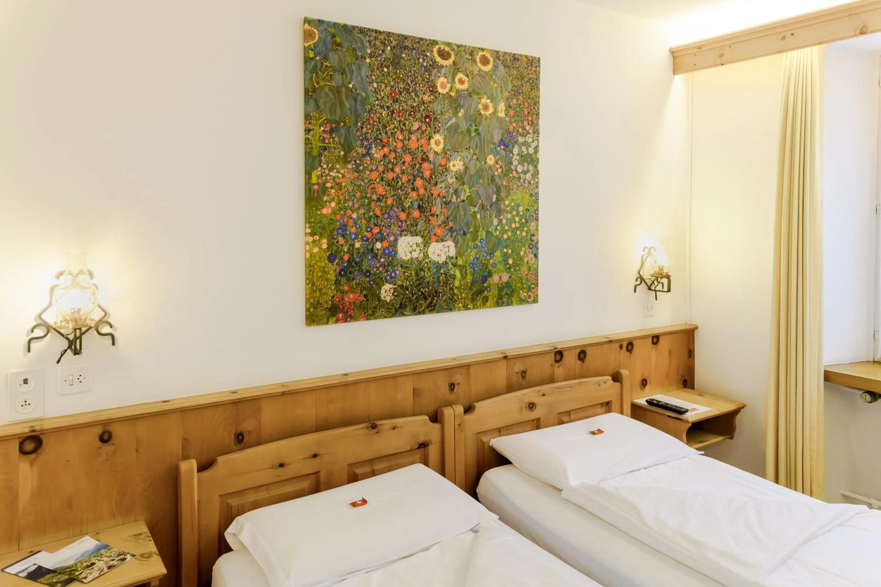 Bed in Poschiavo Suisse Hotel