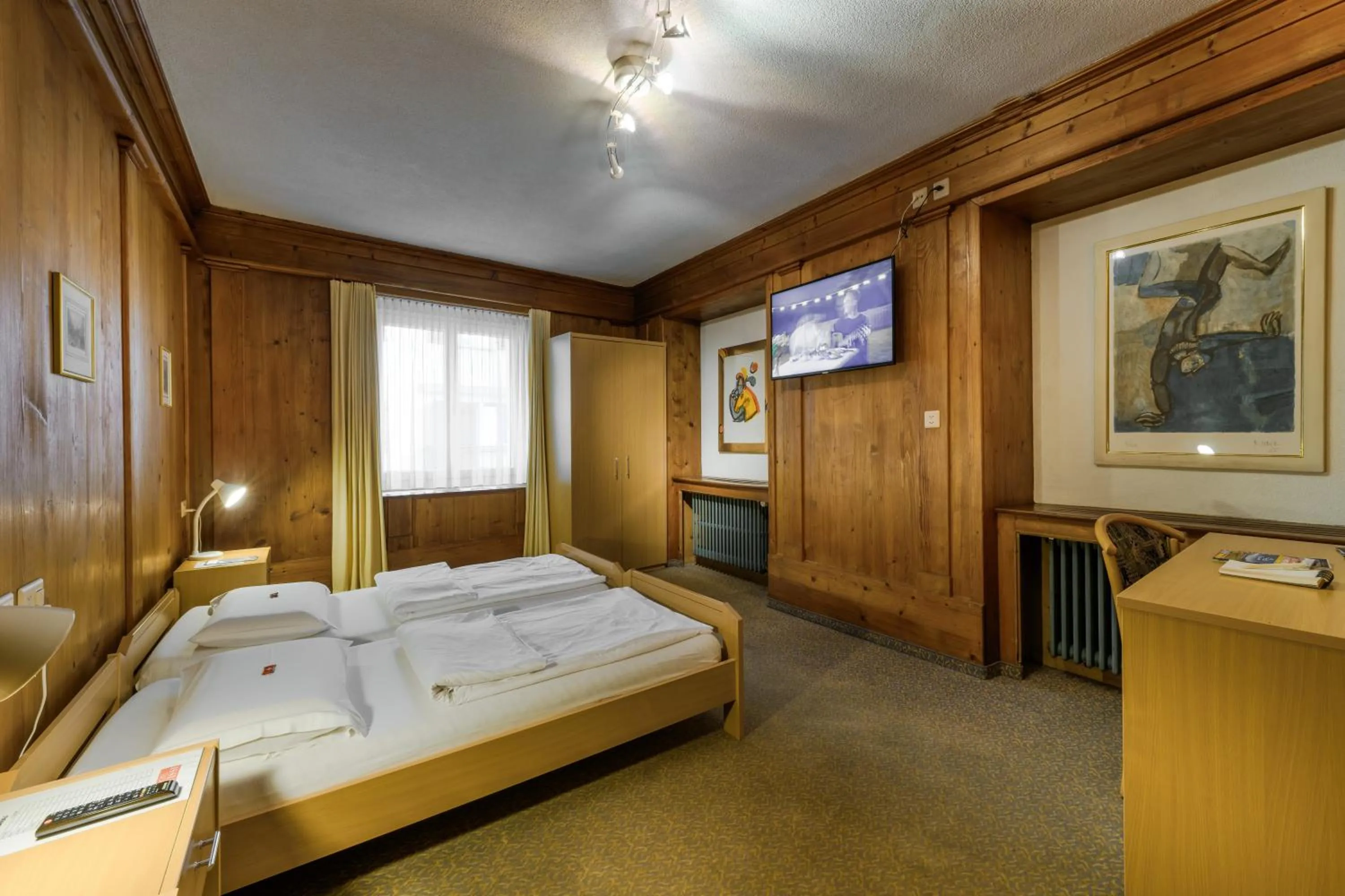 Bed in Poschiavo Suisse Hotel