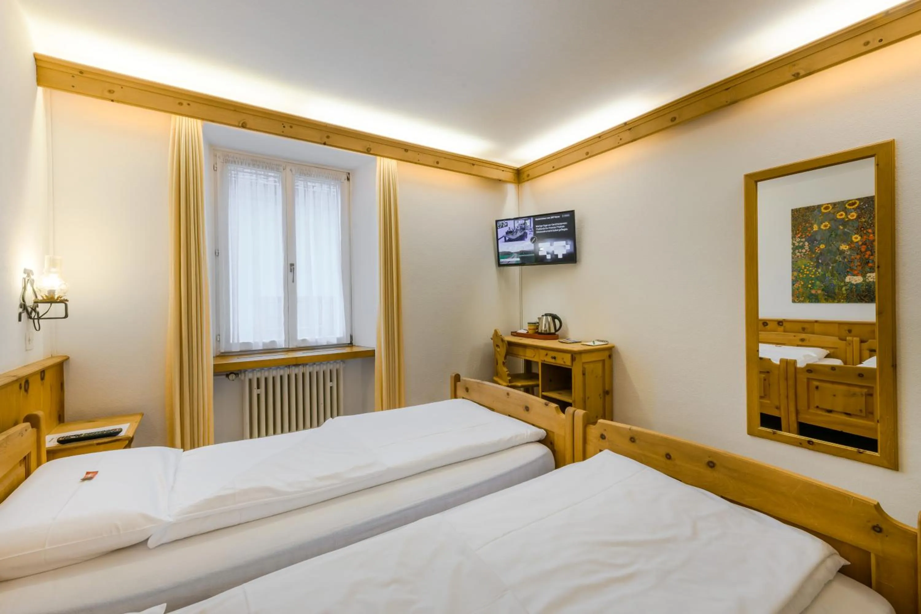 Bed in Poschiavo Suisse Hotel