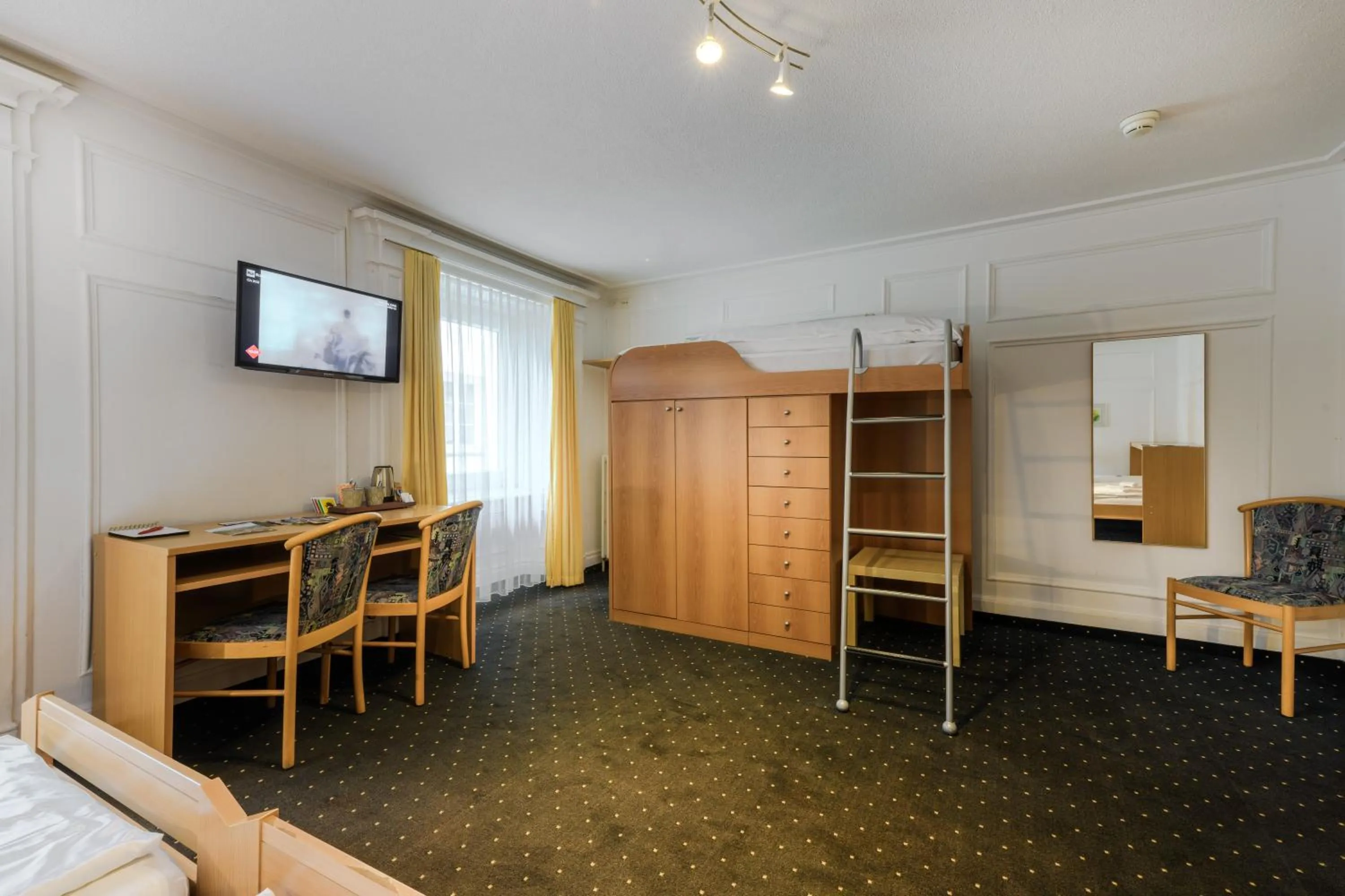 Bed in Poschiavo Suisse Hotel