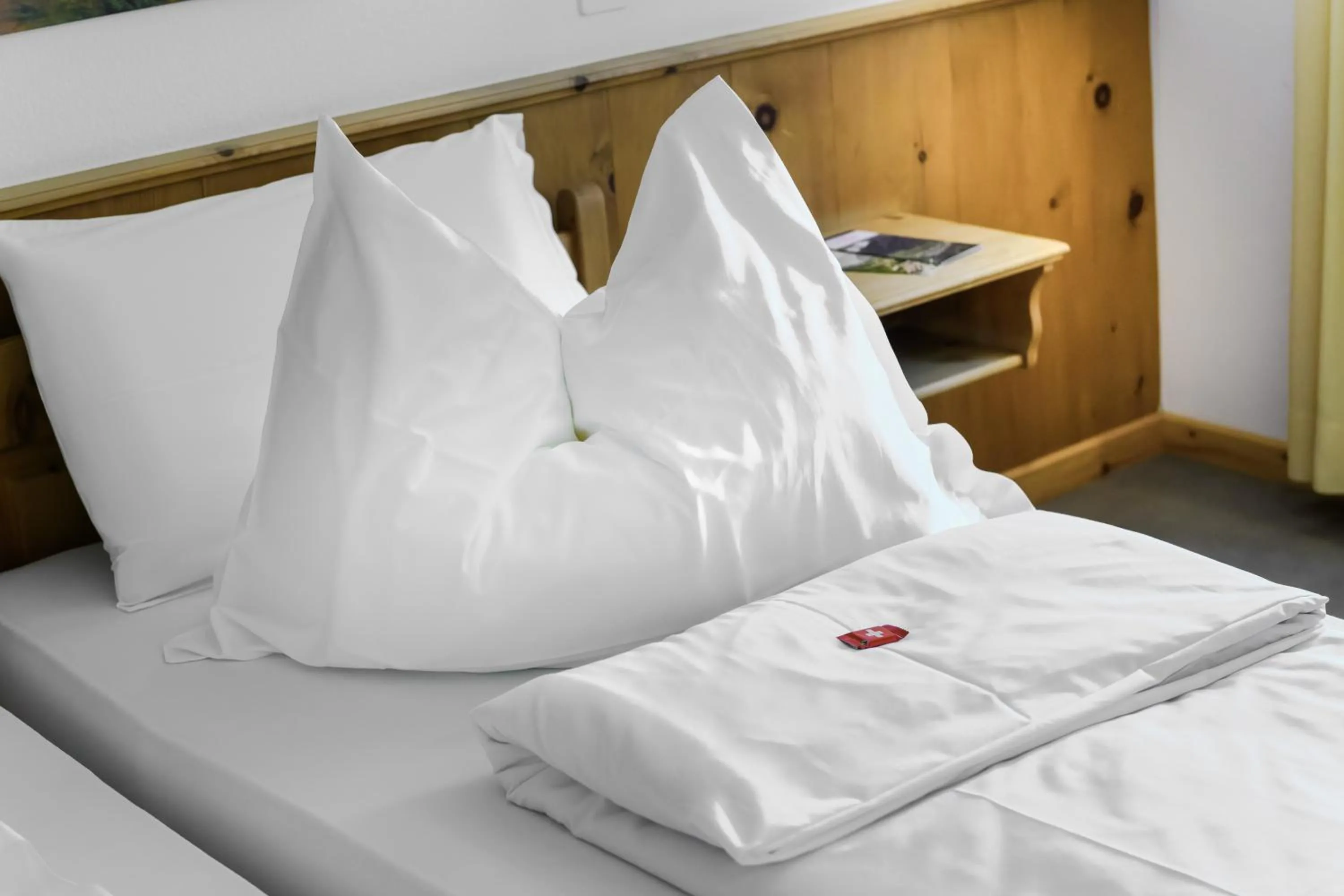 Bed in Poschiavo Suisse Hotel