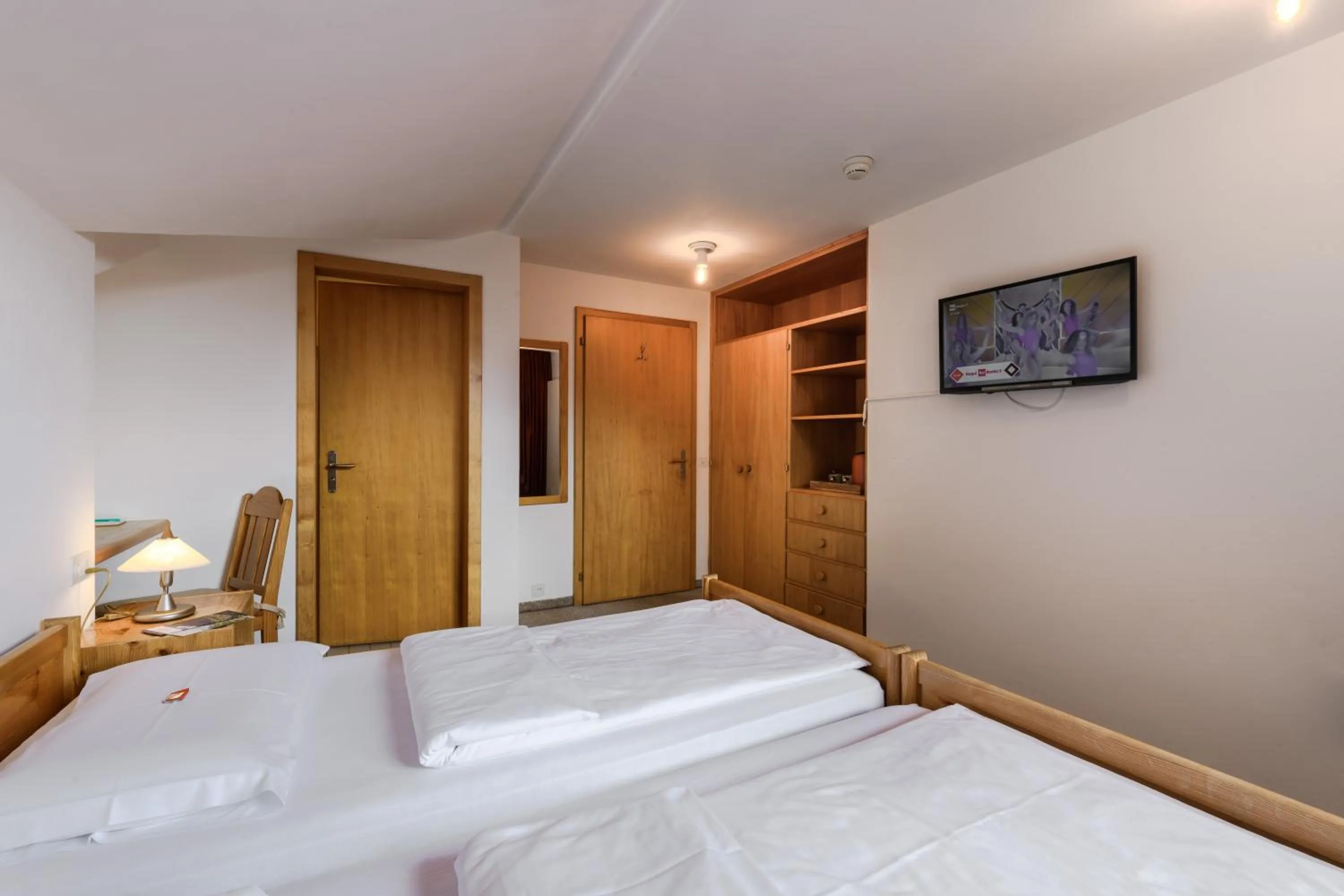 Bed in Poschiavo Suisse Hotel