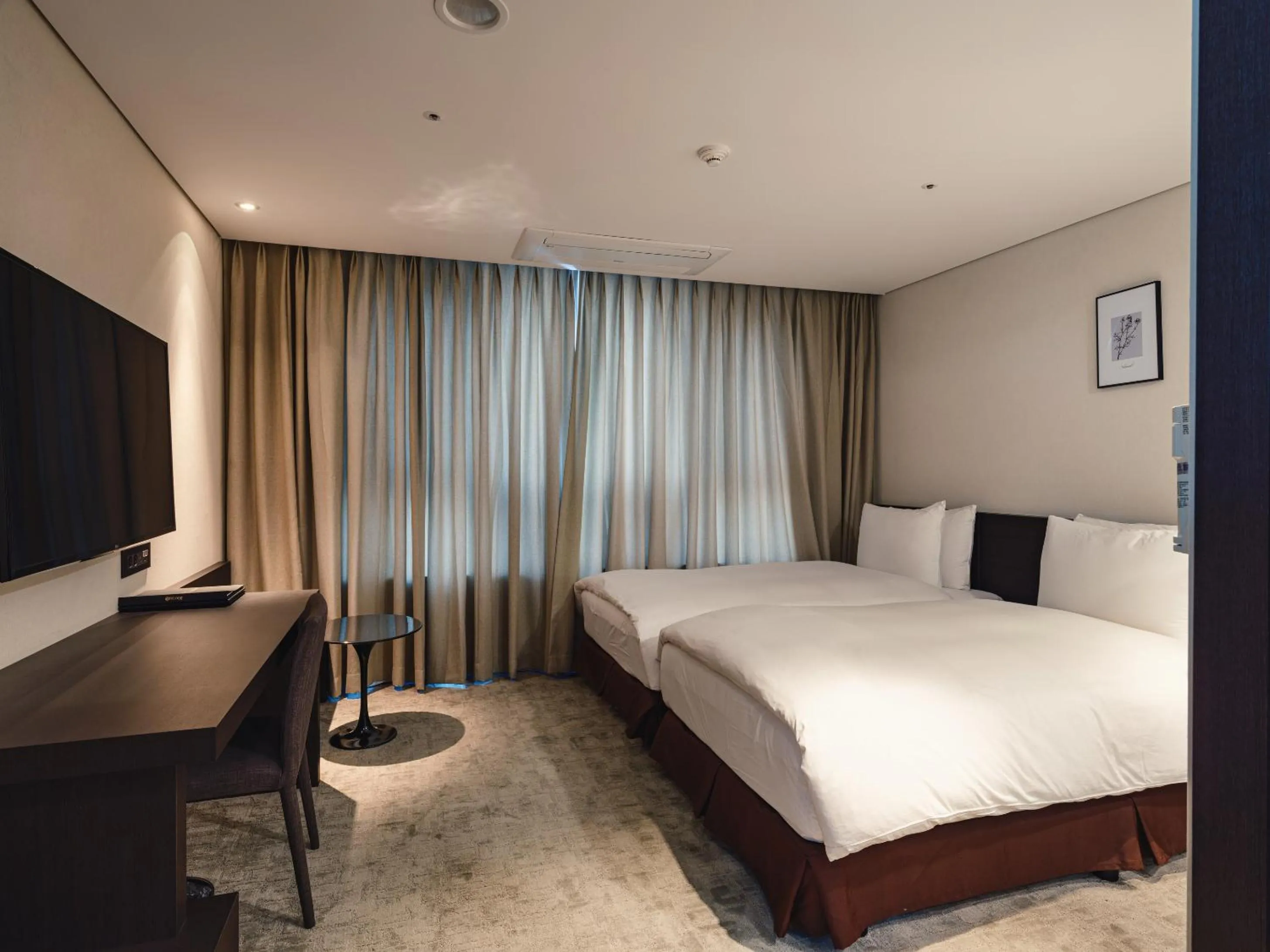 Bed in Ramada Encore by Wyndham CheonAn